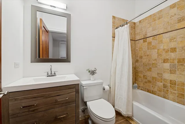 a bathroom with a toilet a sink and a bathtub