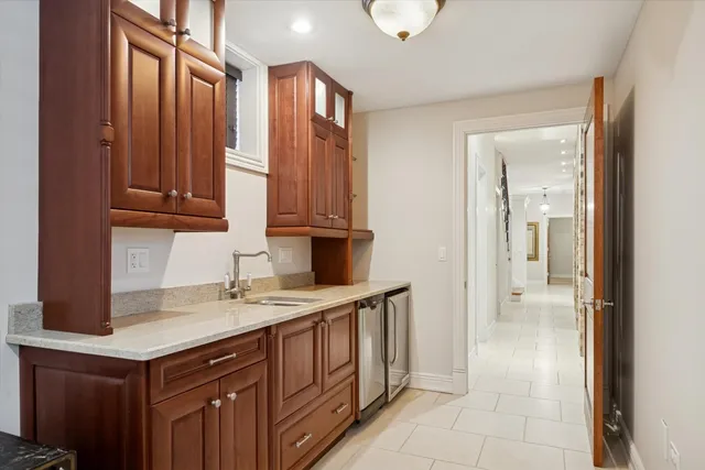 a kitchen with a sink cabinets and appliances