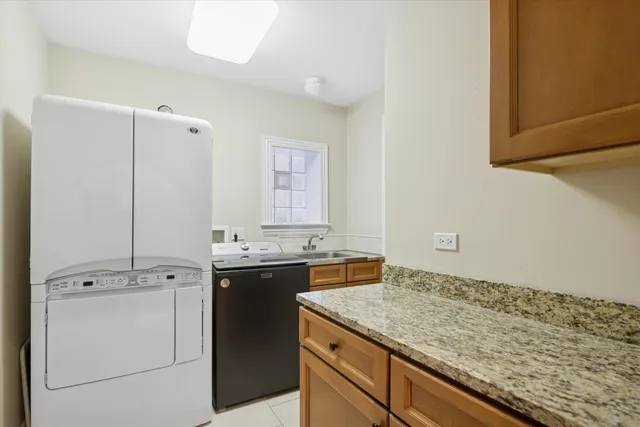 a view of a kitchen with sink stove and refrigerator