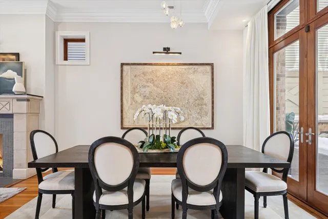 a dining room with furniture and chandelier