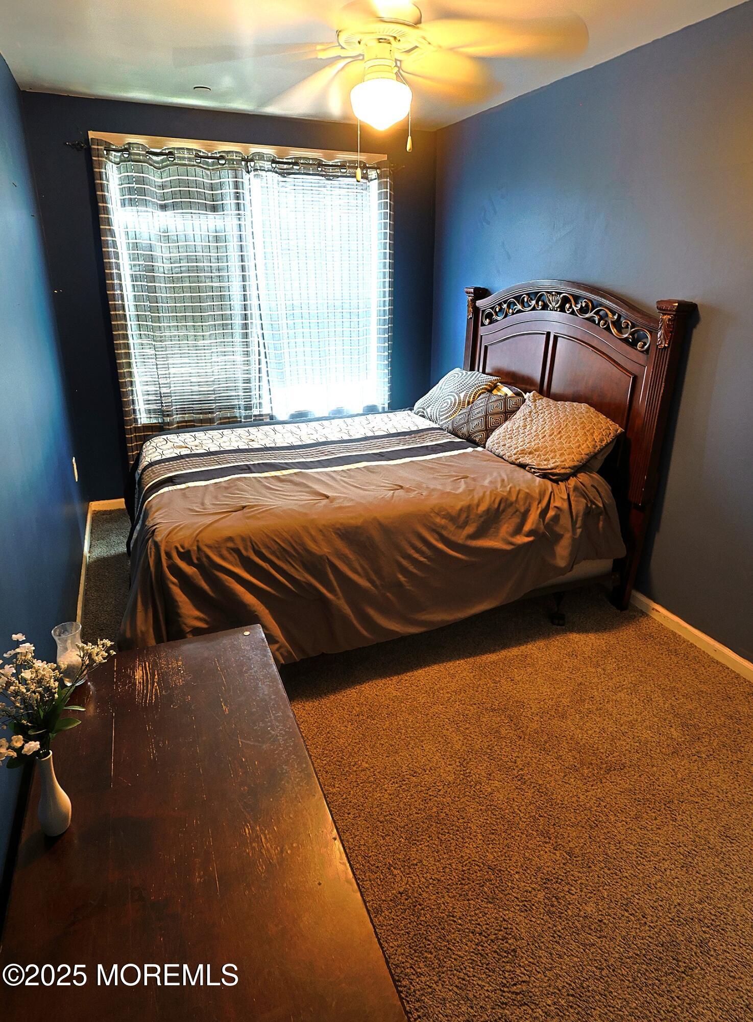1509 Embury Avenue Neptune Township, NJ 07753 - Photo 11 of 15 a bedroom with a bed and window
