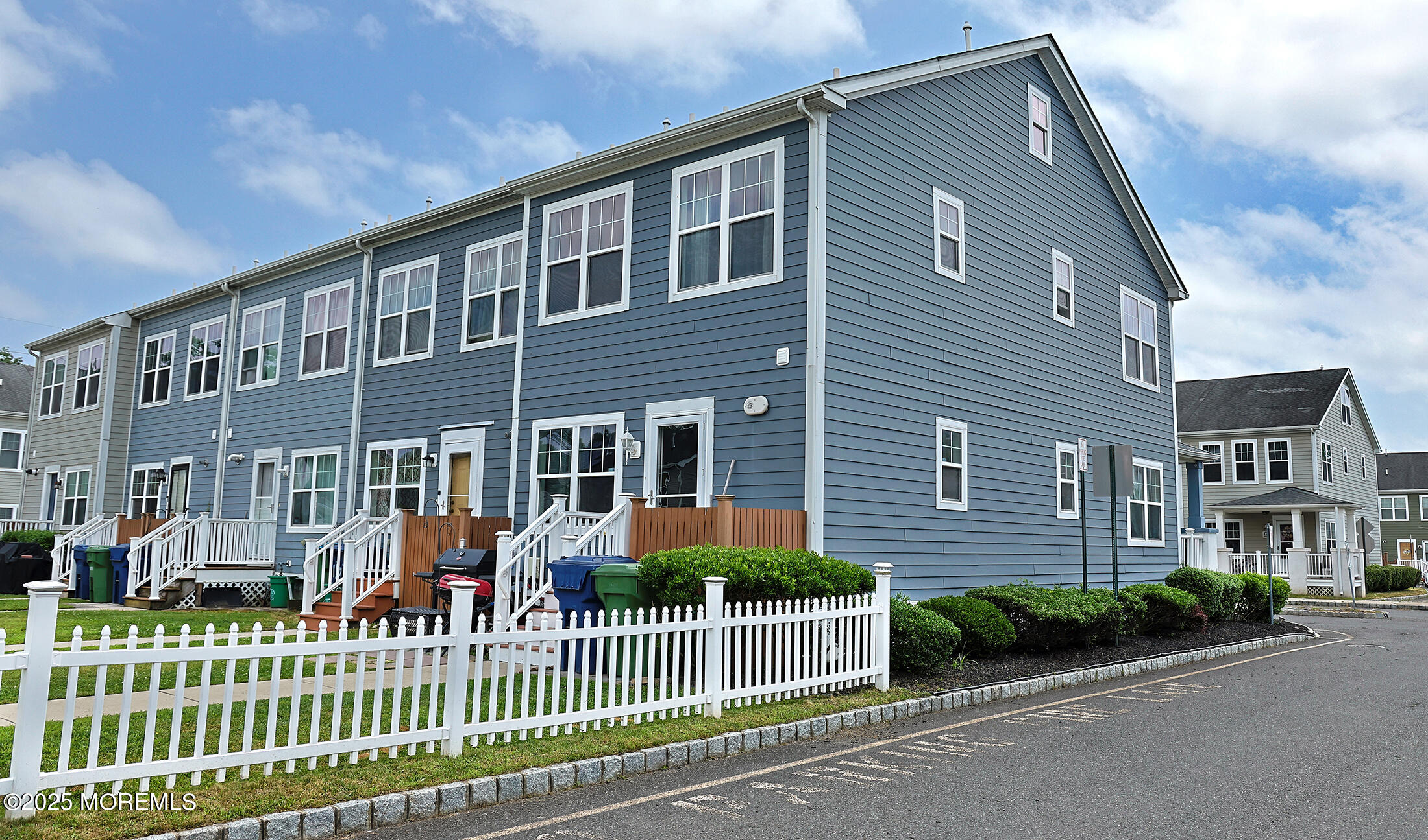 1509 Embury Avenue Neptune Township, NJ 07753 - Photo 15 of 15 a front view of a house with a garden and plants