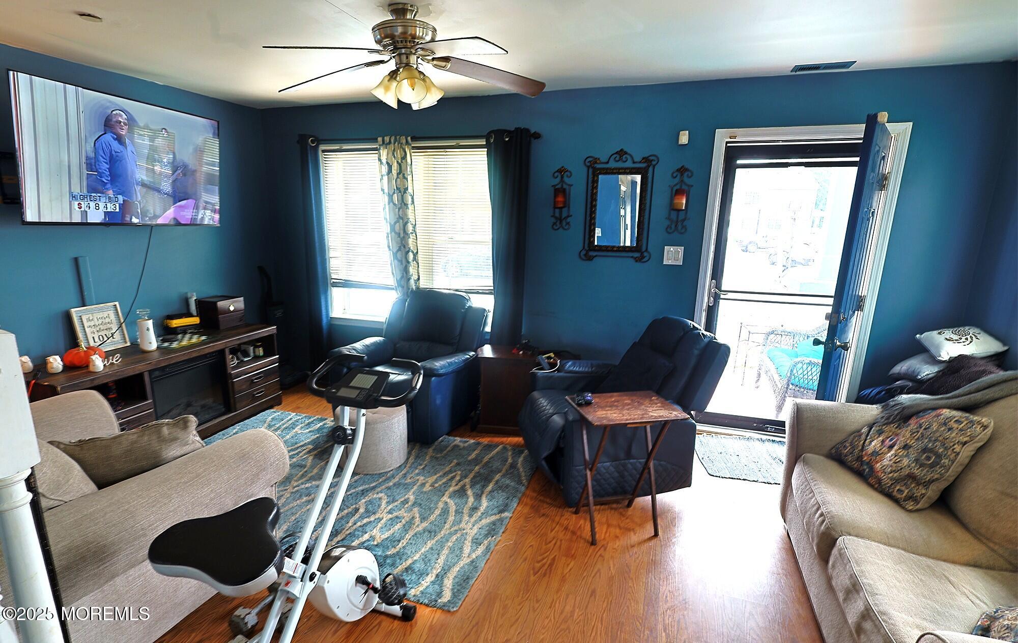 1509 Embury Avenue Neptune Township, NJ 07753 - Photo 3 of 15 a living room with furniture a dining table and a window