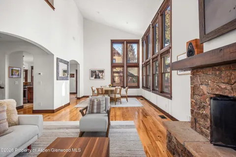 a living room with furniture fireplace and flat screen tv