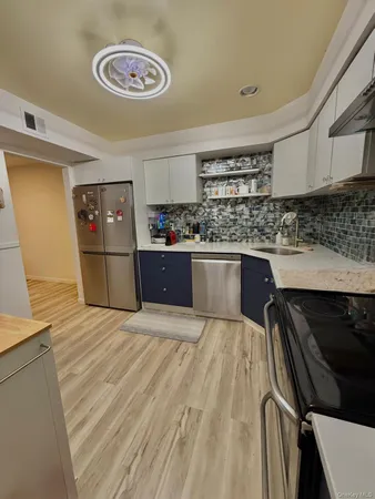 a kitchen with a stove and a refrigerator