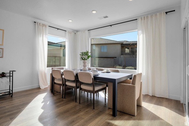 382 North Rhyolite Drive, Unit 111 Hurricane, UT 84737 - Photo 5 of 37 Dining area featuring wood-finish flooring, recessed lighting, and large windows with white curtain panels