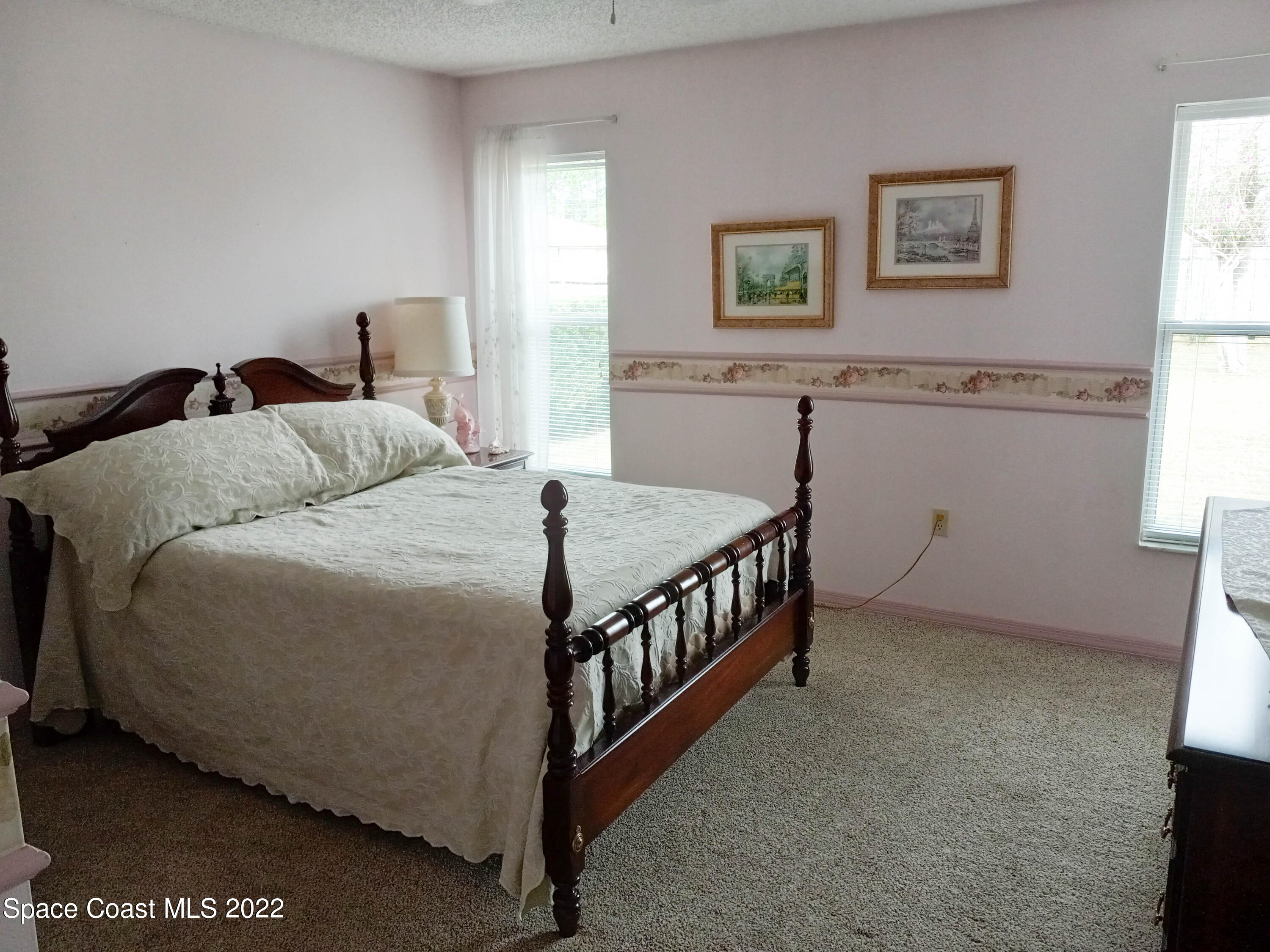 5166 Arlington Road Cocoa, FL 32927 - Photo 13 of 25 a bedroom with a bed and window