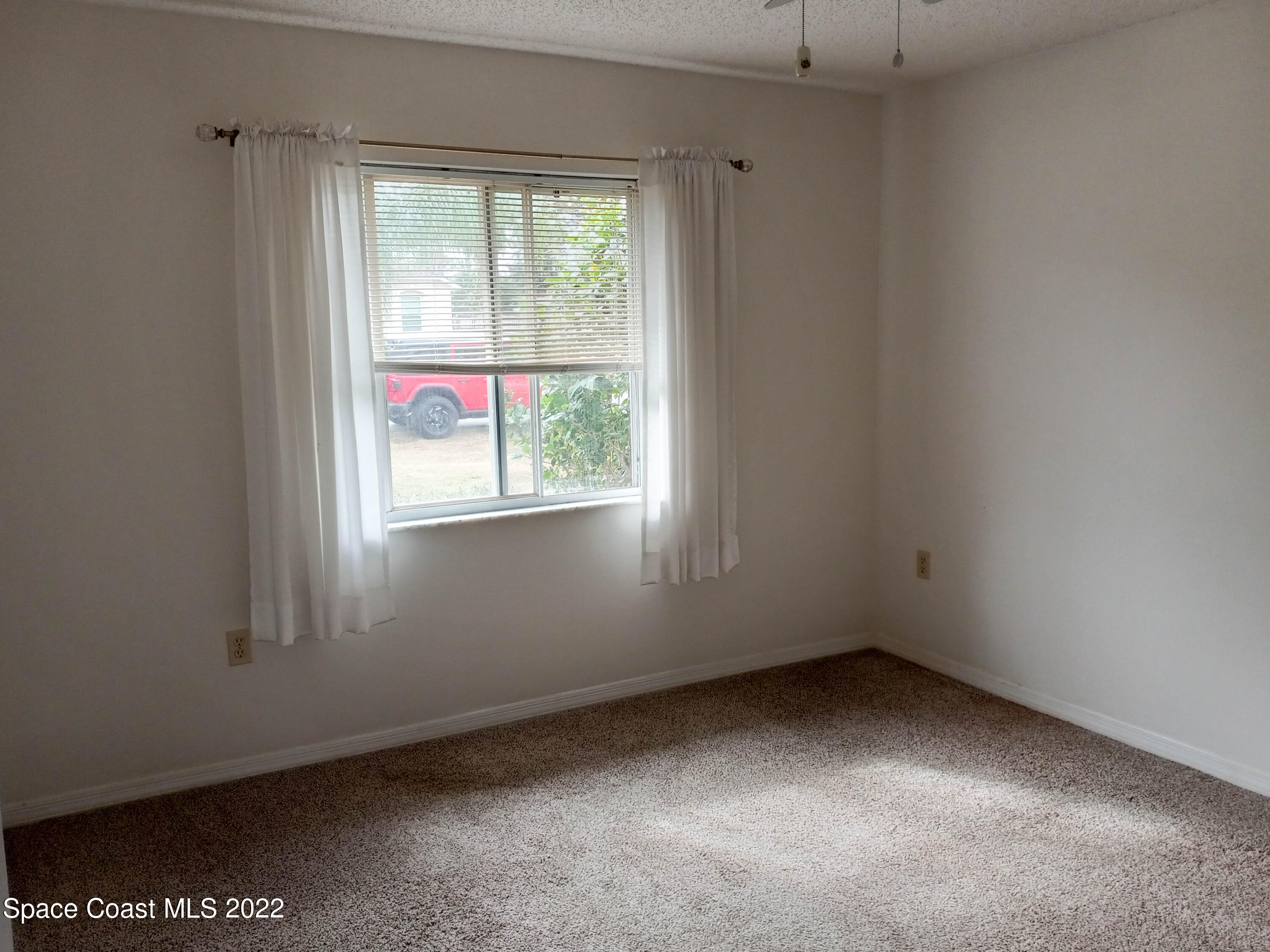 5166 Arlington Road Cocoa, FL 32927 - Photo 15 of 25 an empty room with a window