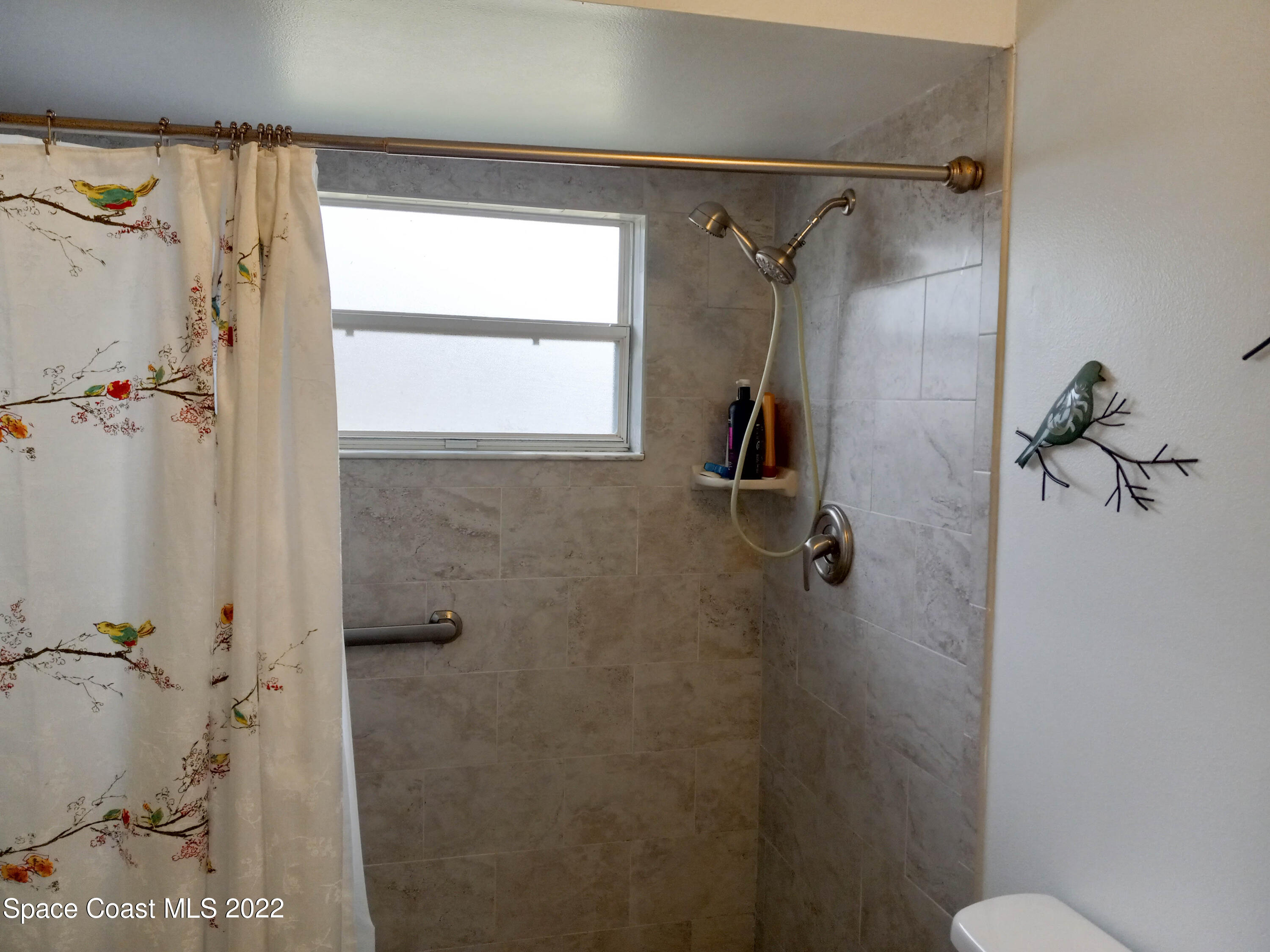 5166 Arlington Road Cocoa, FL 32927 - Photo 17 of 25 a bathroom with a shower
