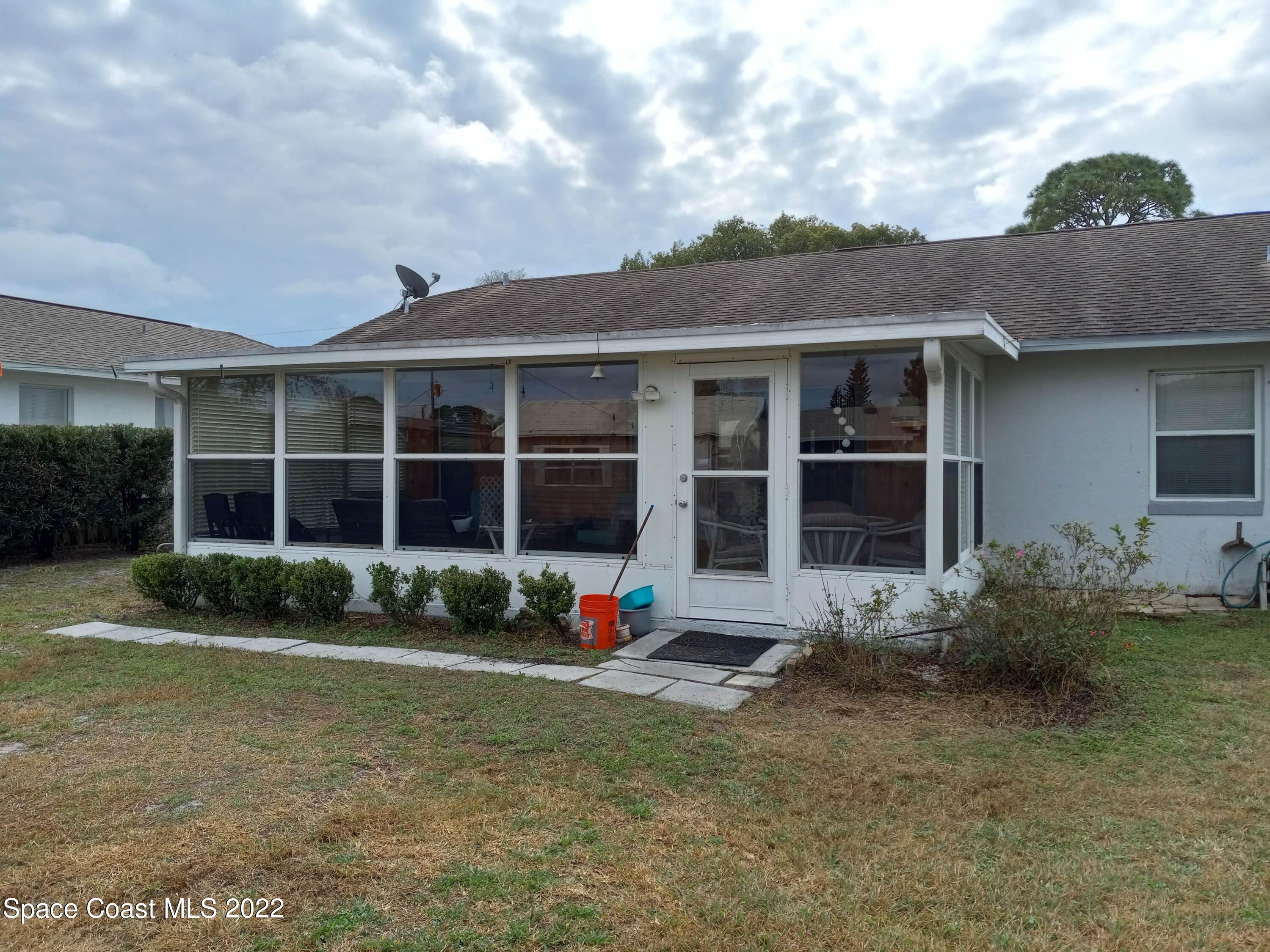 5166 Arlington Road Cocoa, FL 32927 - Photo 24 of 25 a front view of a house with garden