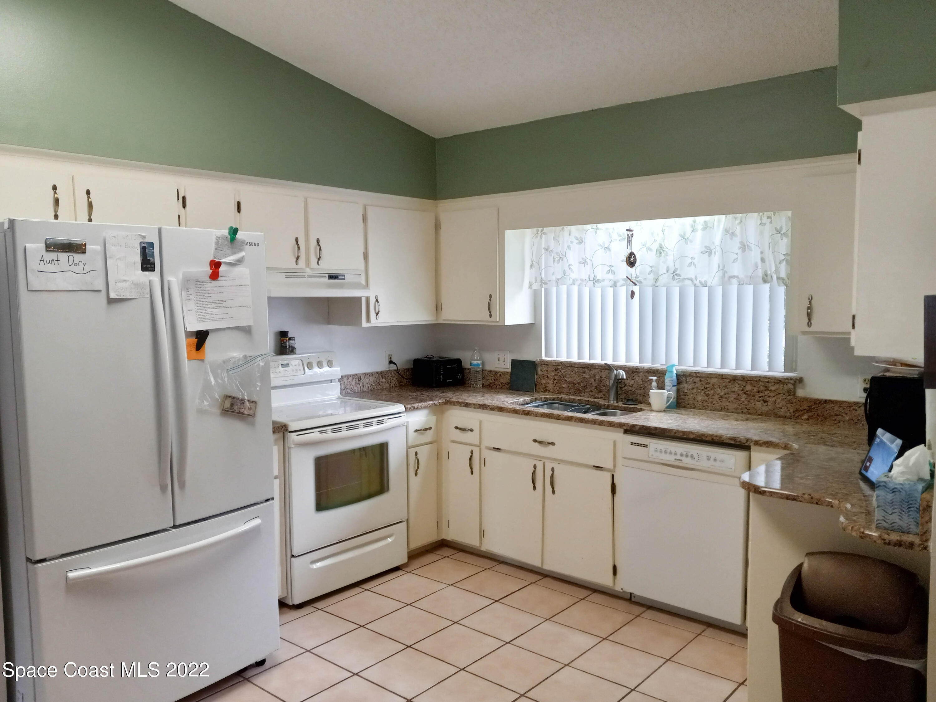 5166 Arlington Road Cocoa, FL 32927 - Photo 5 of 25 a kitchen with cabinets appliances and a window