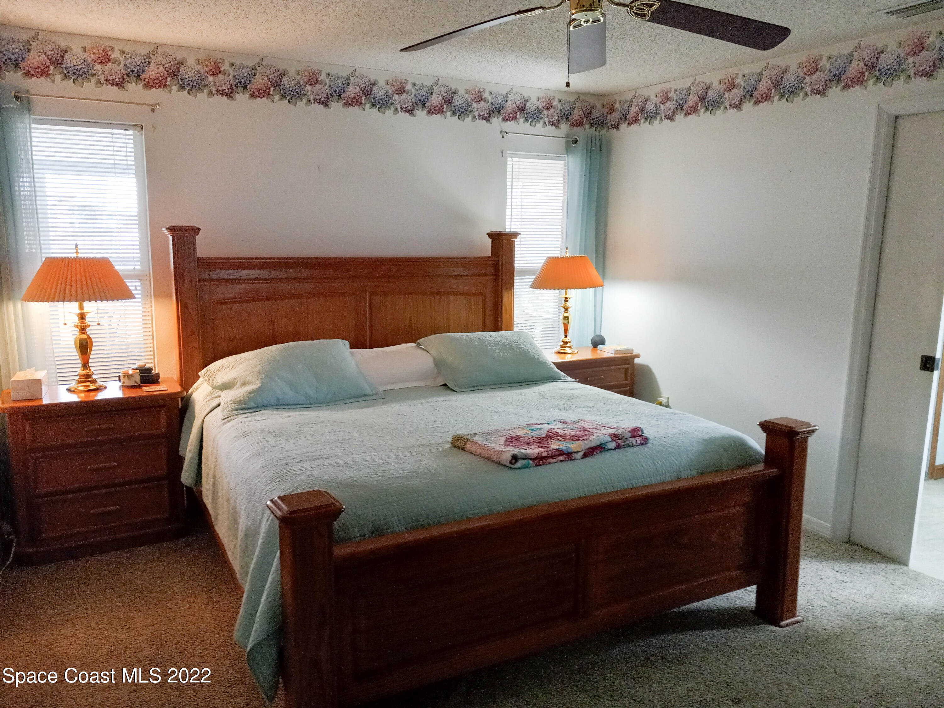 5166 Arlington Road Cocoa, FL 32927 - Photo 8 of 25 a bedroom with a bed and dresser