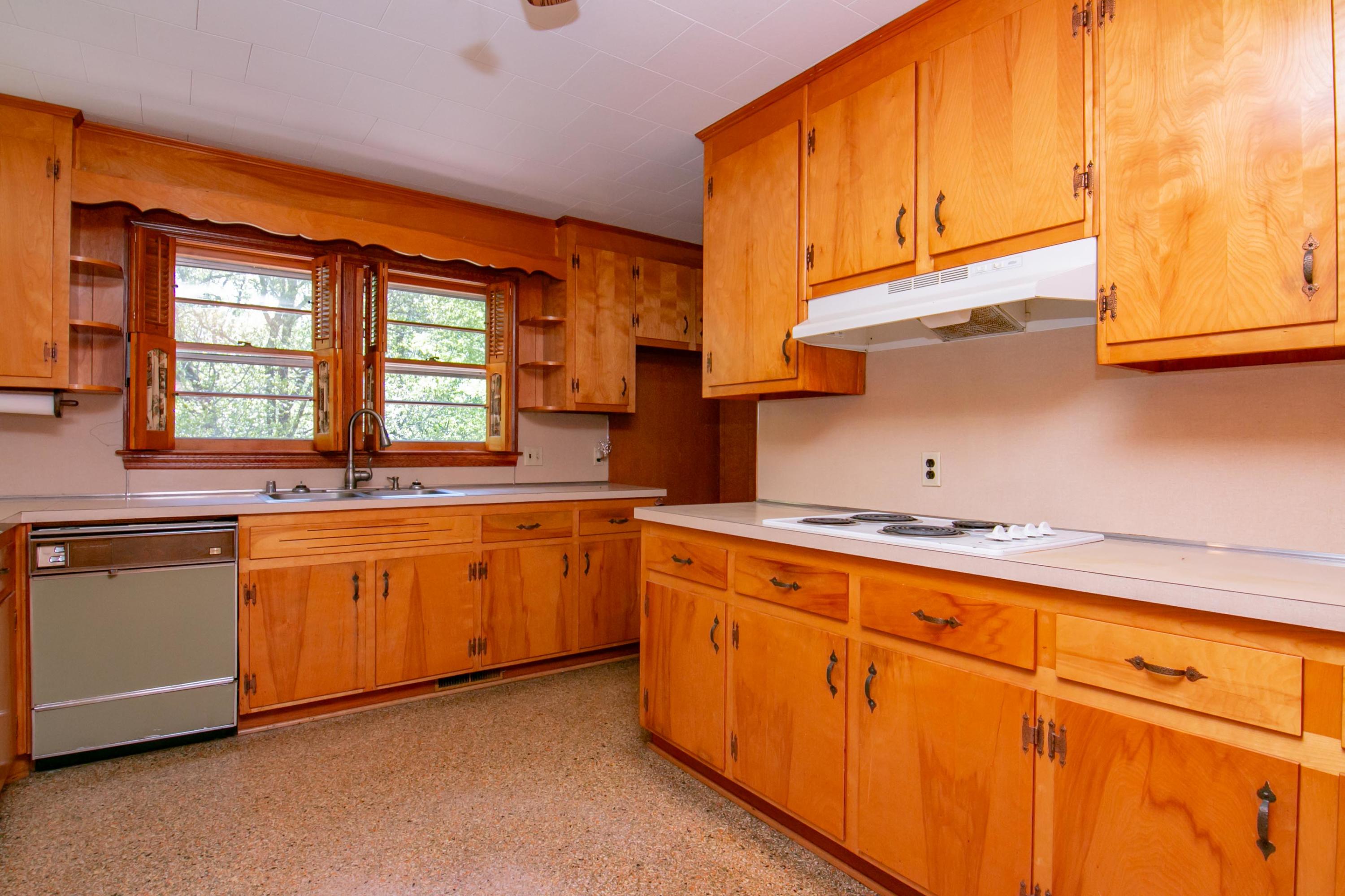 3256 Sago Road Callands, VA 24530 - Photo 11 of 59 a kitchen with stainless steel appliances granite countertop a sink a stove and a refrigerator