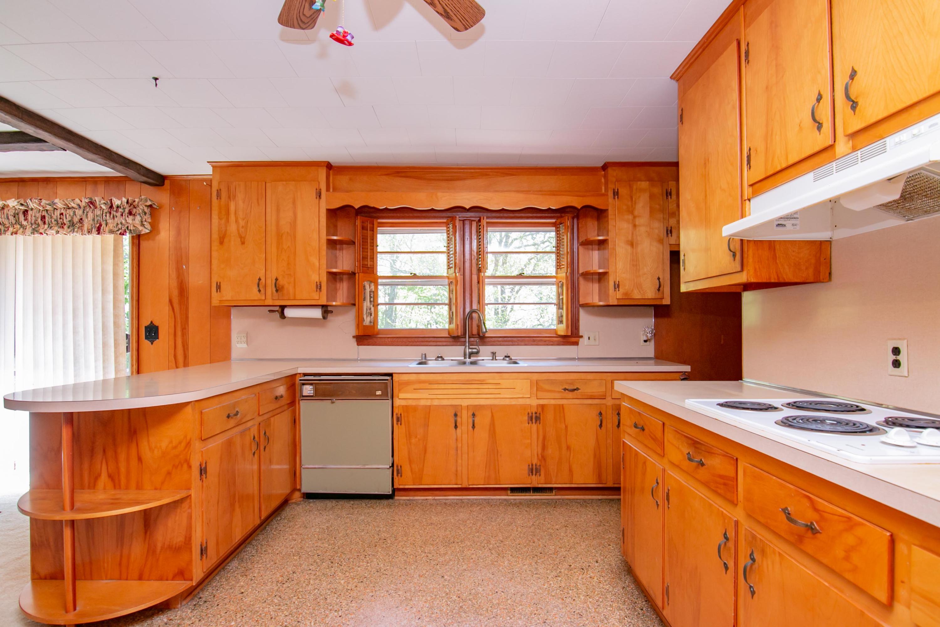 3256 Sago Road Callands, VA 24530 - Photo 12 of 59 a kitchen with stainless steel appliances granite countertop a stove and a sink