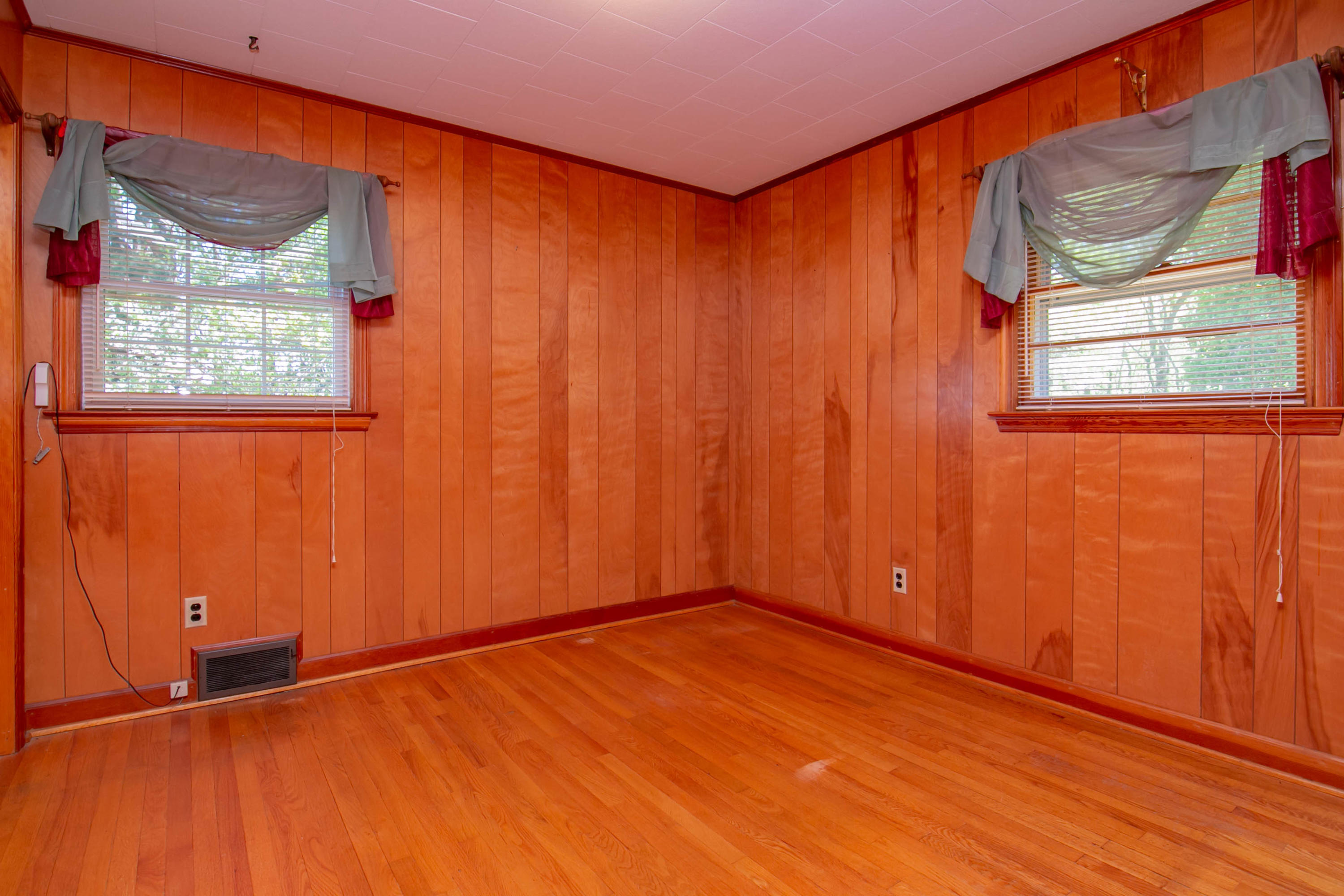 3256 Sago Road Callands, VA 24530 - Photo 20 of 59 a view of an empty room with a window and wooden floor