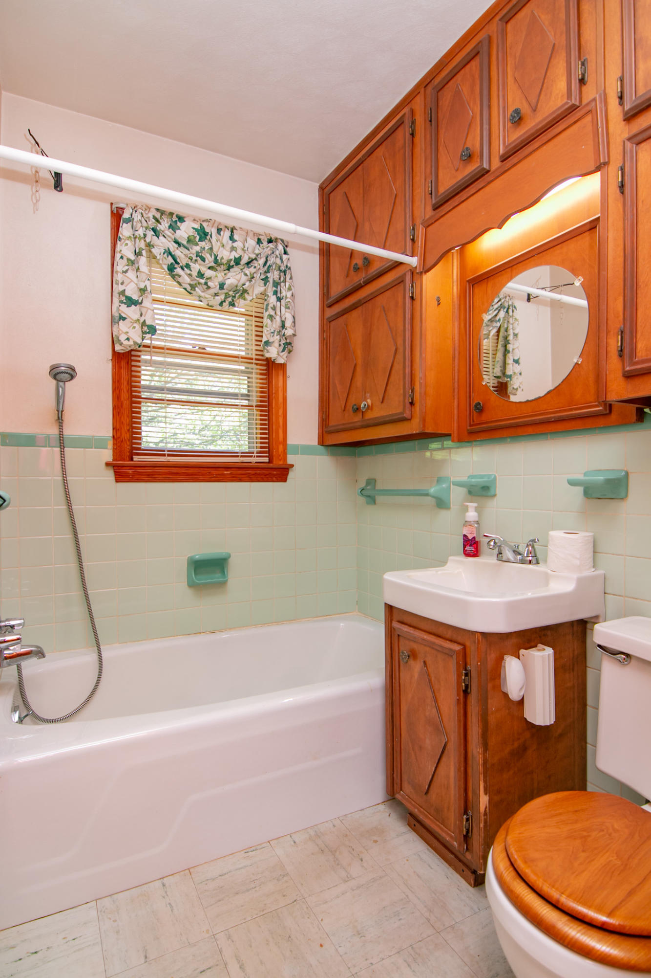 3256 Sago Road Callands, VA 24530 - Photo 23 of 59 a bathroom with a sink a toilet and a shower curtain