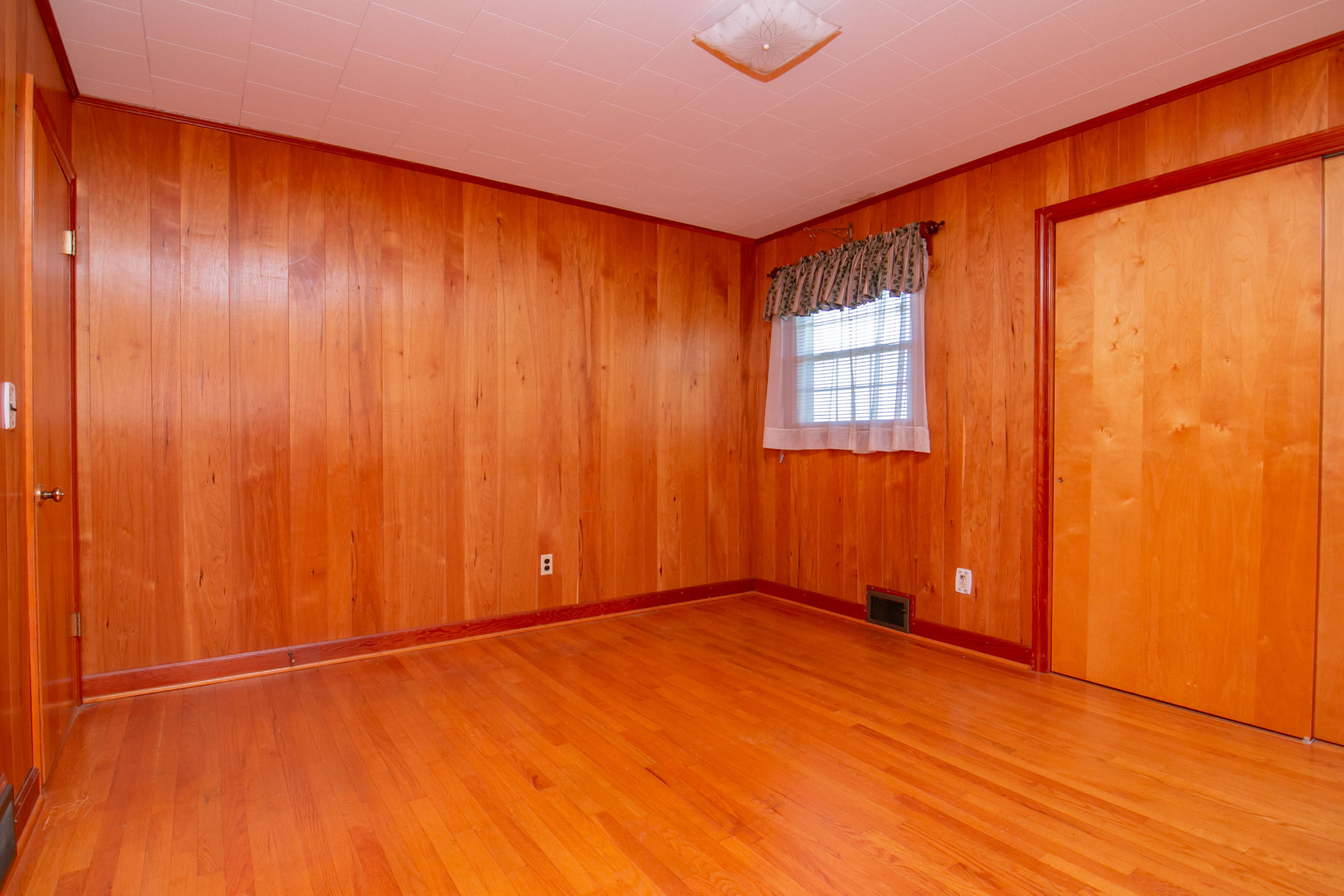 3256 Sago Road Callands, VA 24530 - Photo 25 of 59 an empty room with wooden floor and windows