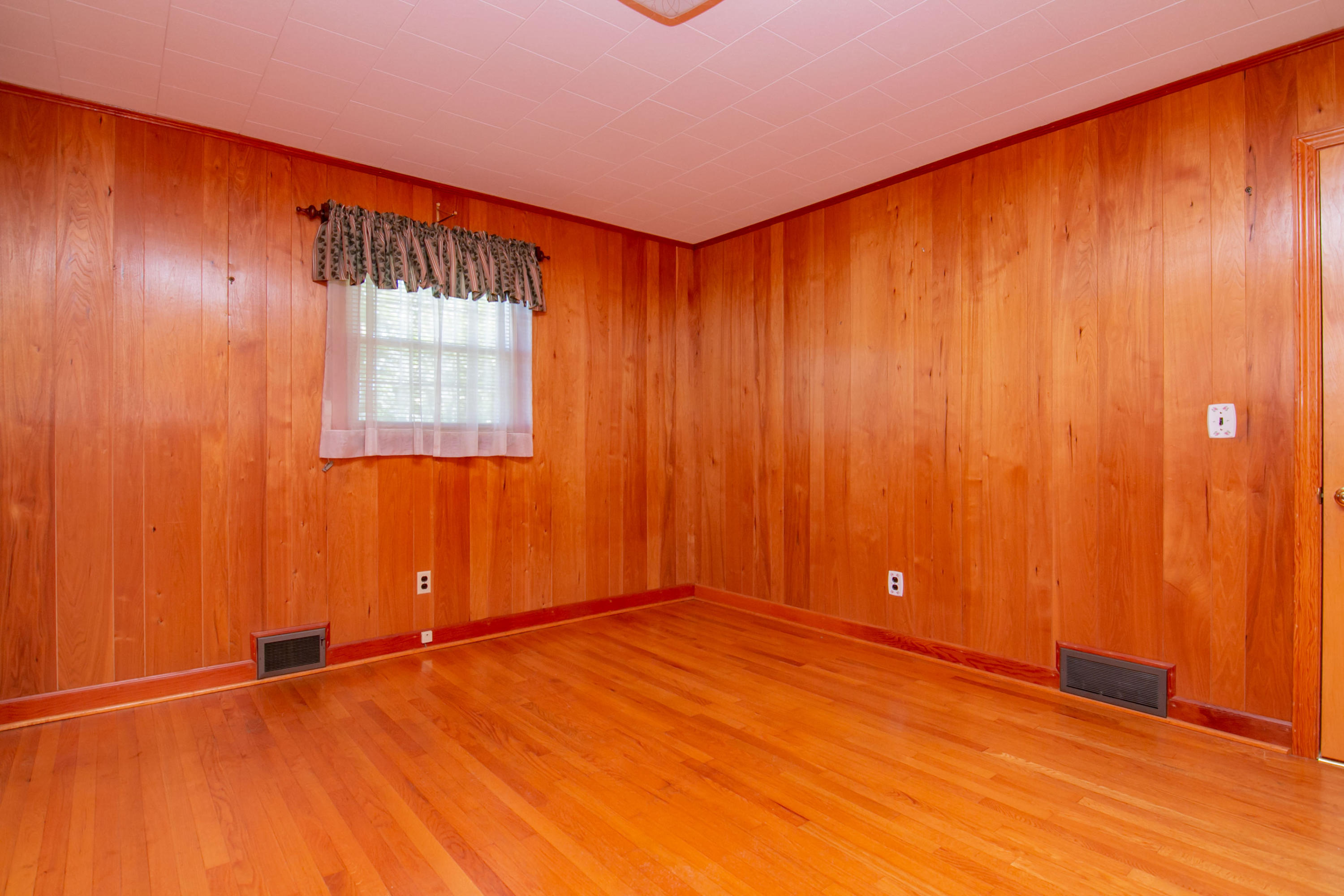 3256 Sago Road Callands, VA 24530 - Photo 27 of 59 an empty room with wooden floor and windows