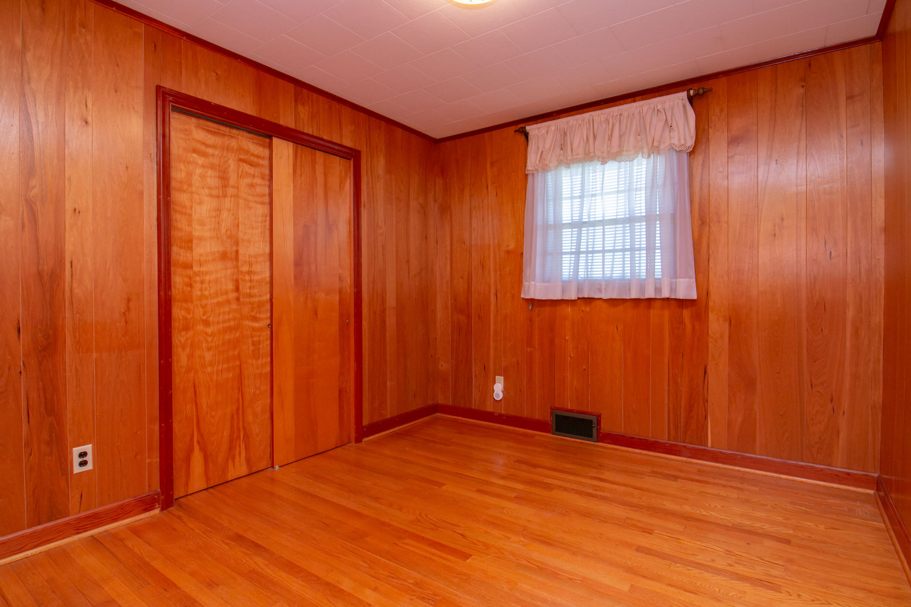 3256 Sago Road Callands, VA 24530 - Photo 30 of 59 an empty room with wooden floor and windows