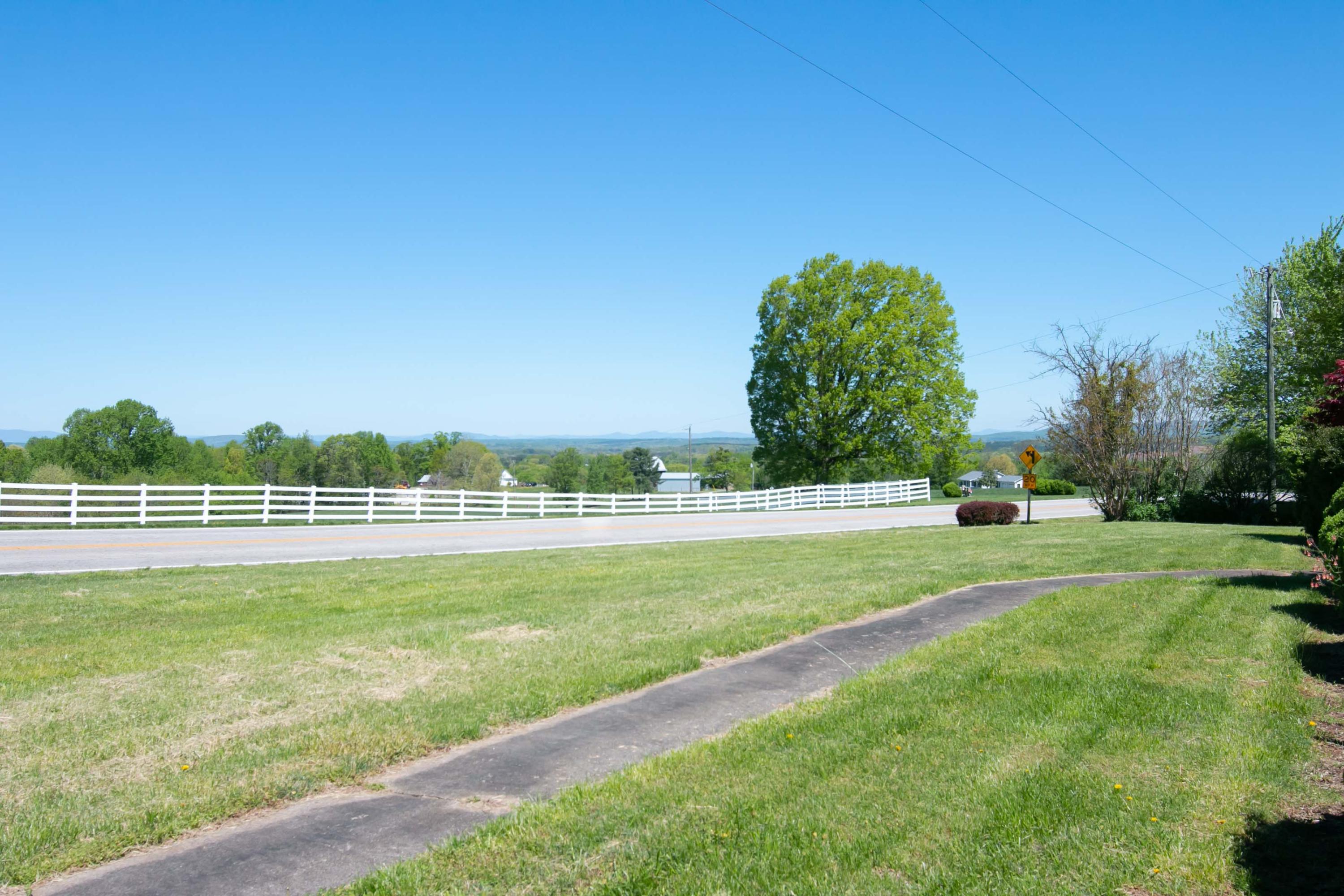 3256 Sago Road Callands, VA 24530 - Photo 45 of 59 a view of a golf course with a lake