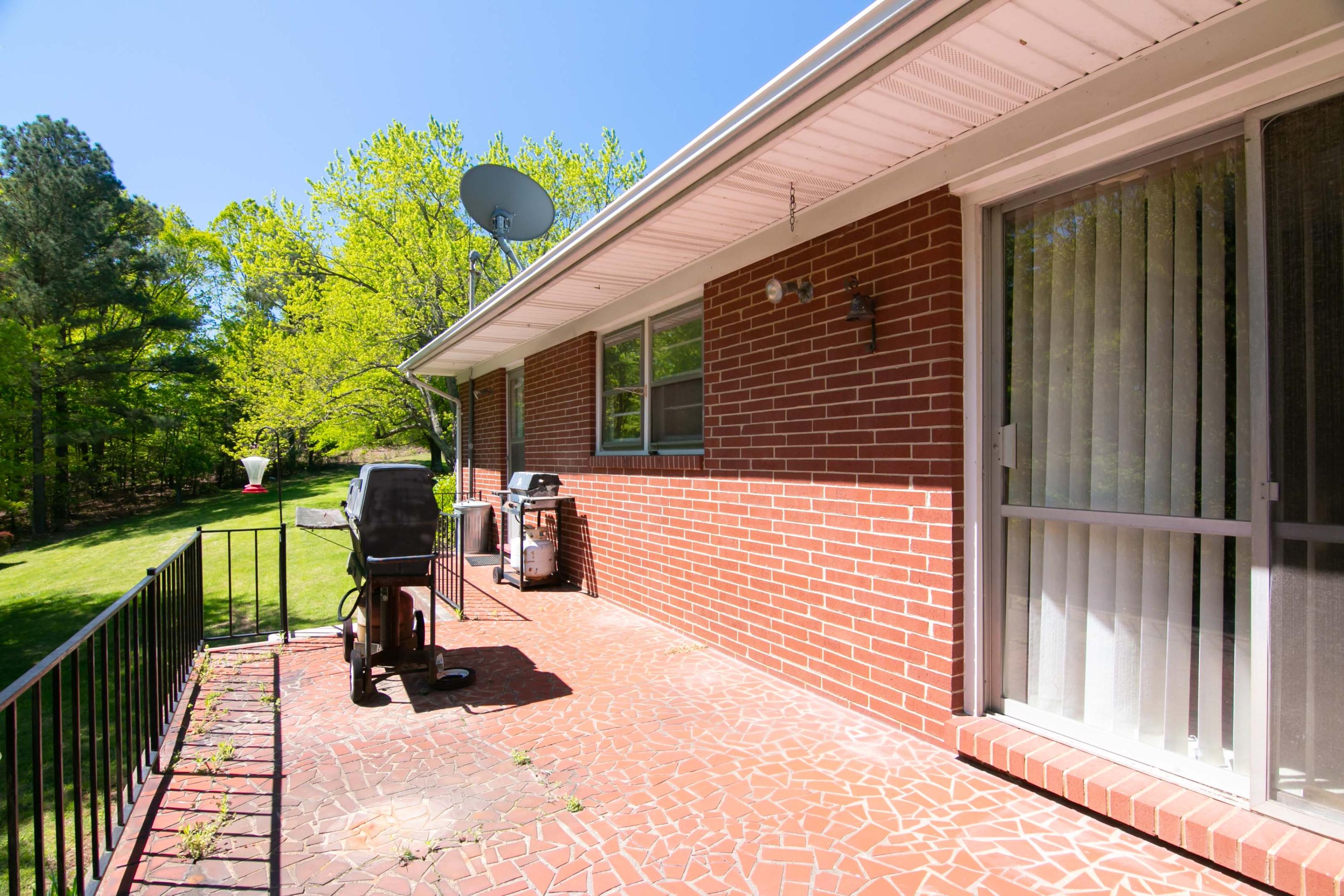 3256 Sago Road Callands, VA 24530 - Photo 46 of 59 a view of a terrace with chairs and a barbeque