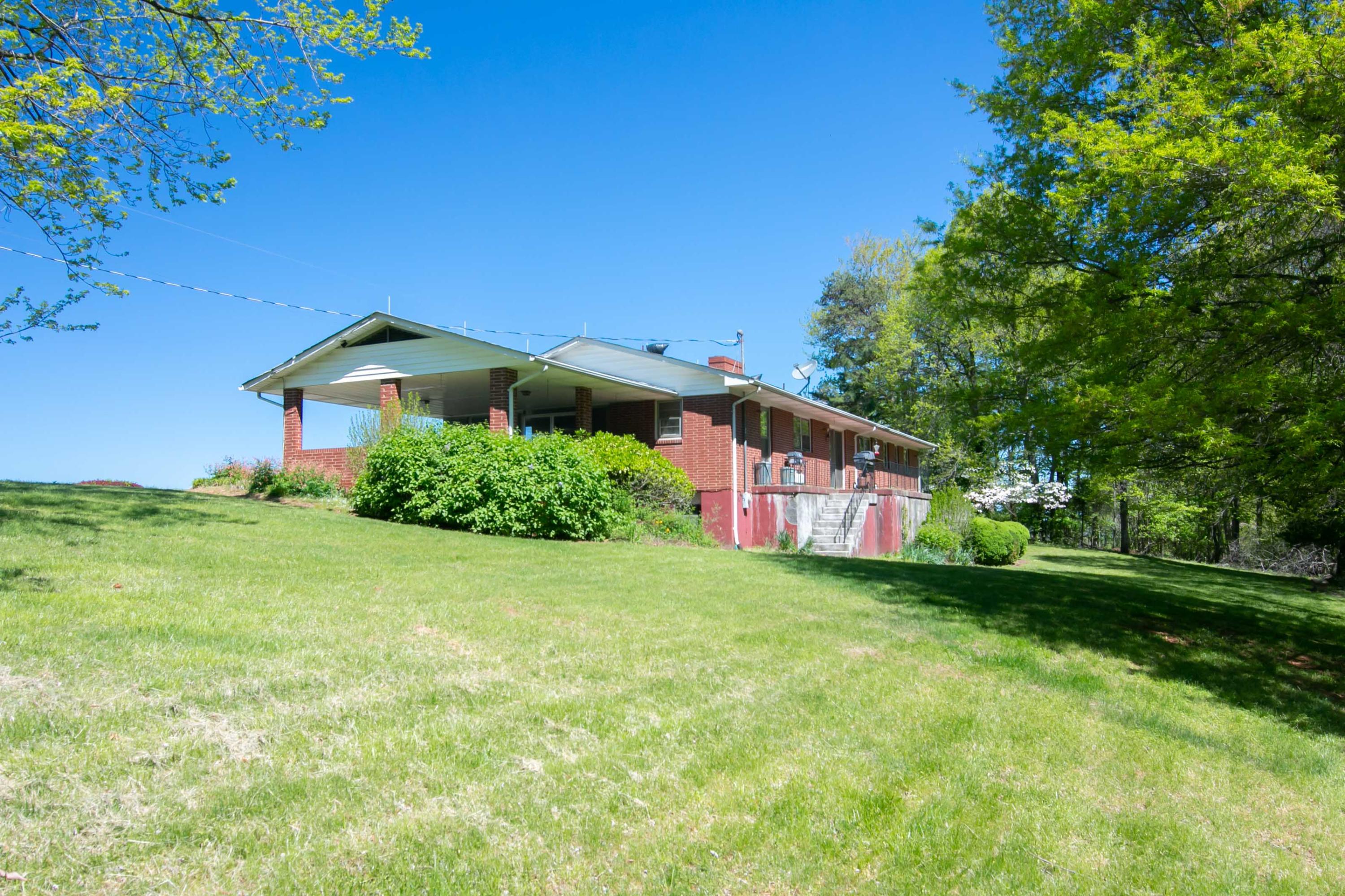 3256 Sago Road Callands, VA 24530 - Photo 51 of 59 a front view of a house with a yard