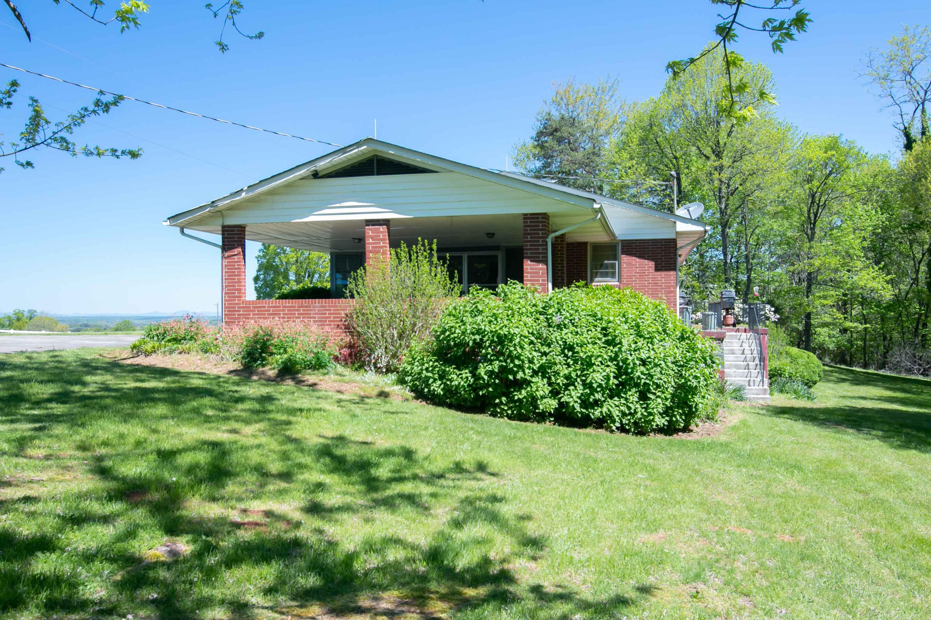 3256 Sago Road Callands, VA 24530 - Photo 52 of 59 a front view of a house with garden