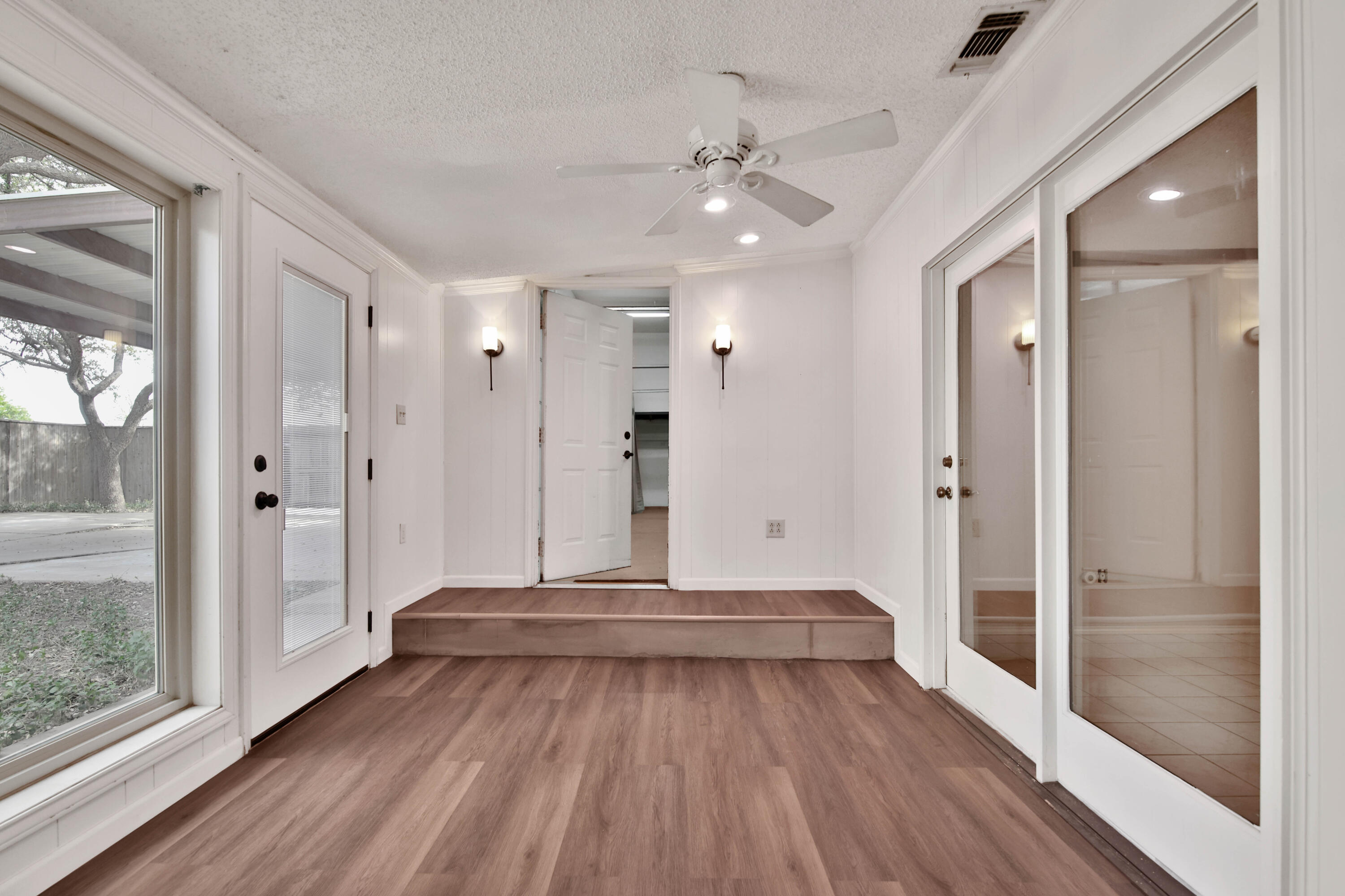 5721 80th Street Lubbock, TX 79424 - Photo 31 of 41 Sunroom Leading to Shop