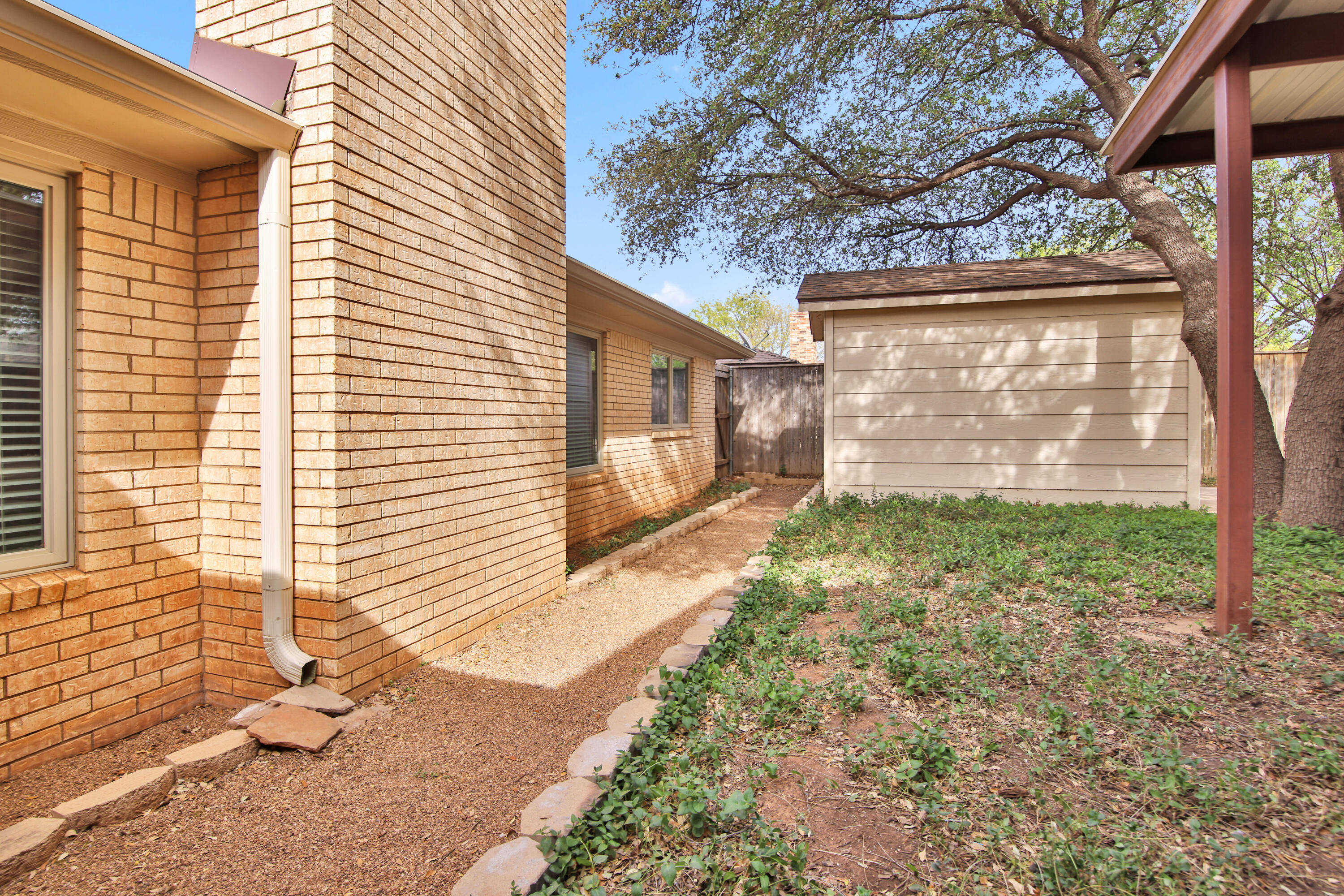5721 80th Street Lubbock, TX 79424 - Photo 41 of 41 Pathway to Side Gate