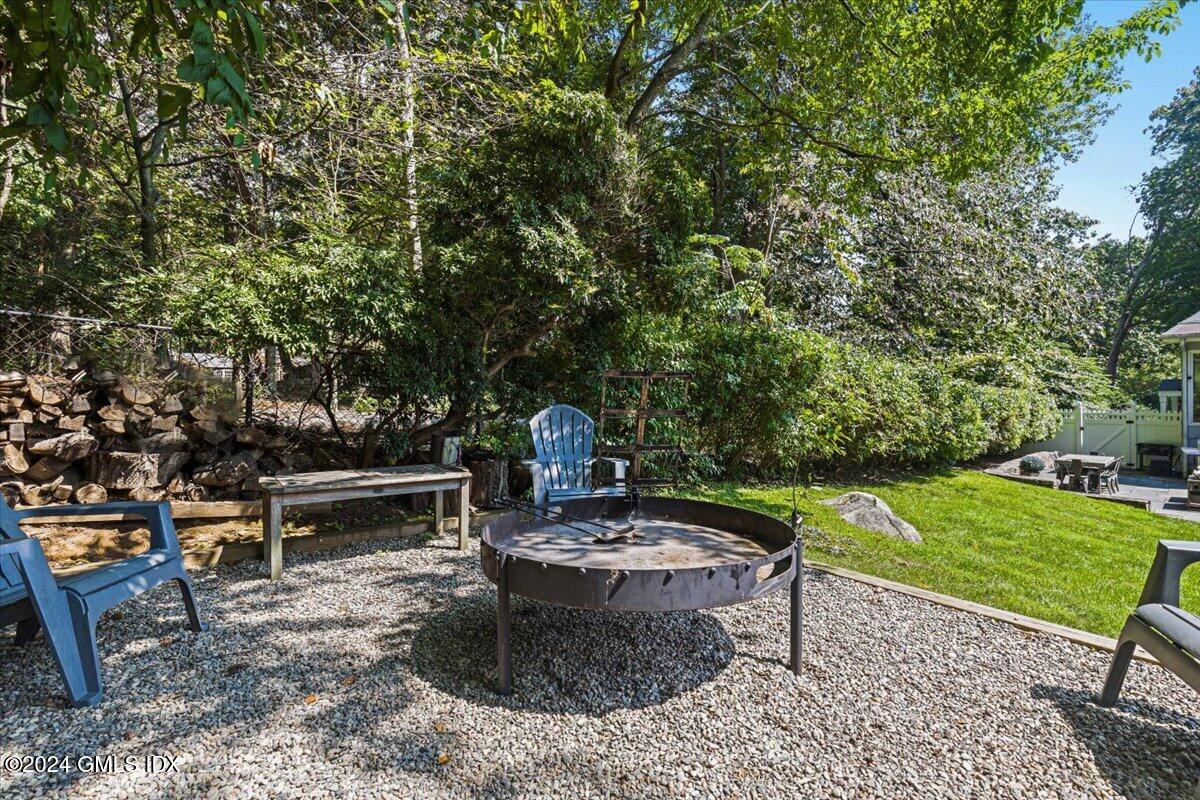 70 Gregory Road Cos Cob, CT 06807 - Photo 33 of 39 a view of a backyard with sitting area