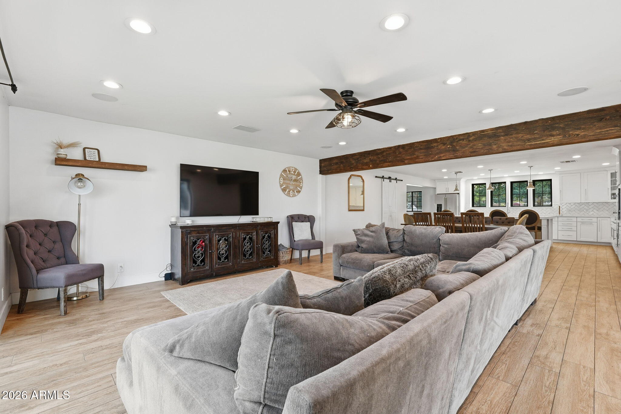 2858 East Redfield Road Gilbert, AZ 85234 - Photo 22 of 60 a living room with furniture and a flat screen tv