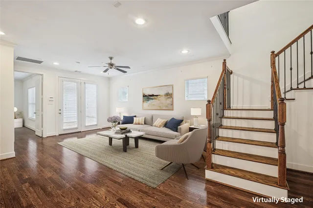 a kitchen with stainless steel appliances granite countertop a sink refrigerator and cabinets