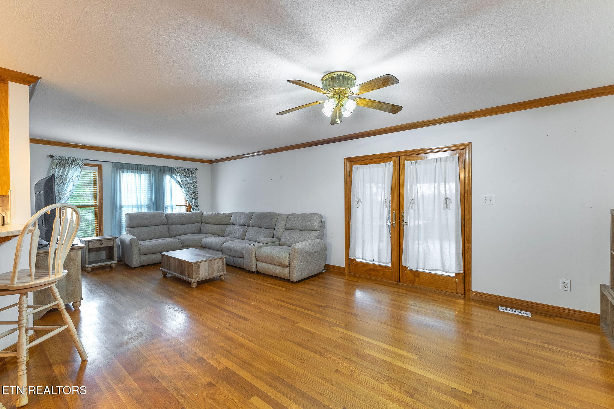 6251 Grimes Road Loudon, TN 37774 - Photo 11 of 43 a living room with furniture and a wooden floor