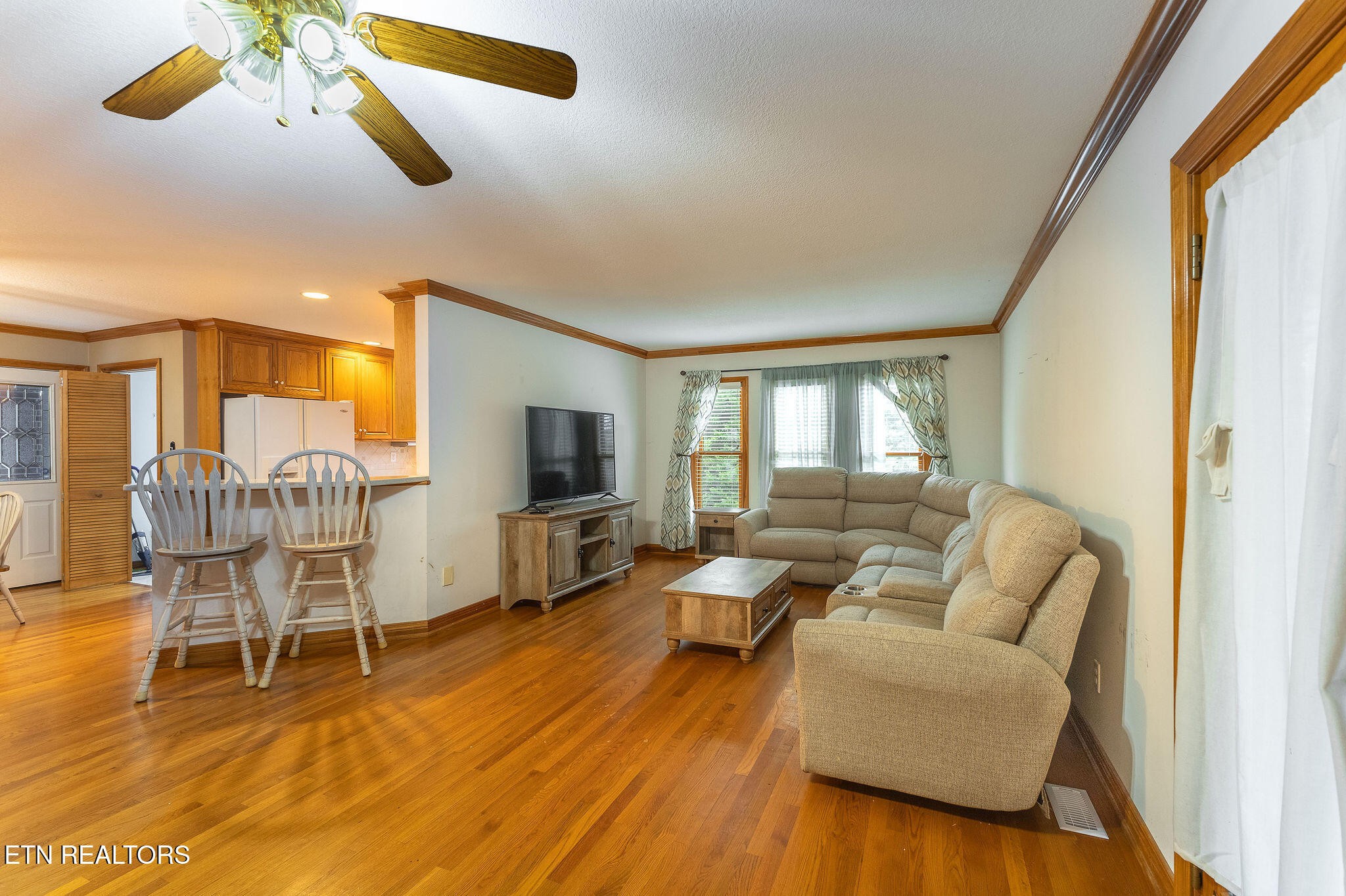 6251 Grimes Road Loudon, TN 37774 - Photo 12 of 43 a living room with furniture and a flat screen tv