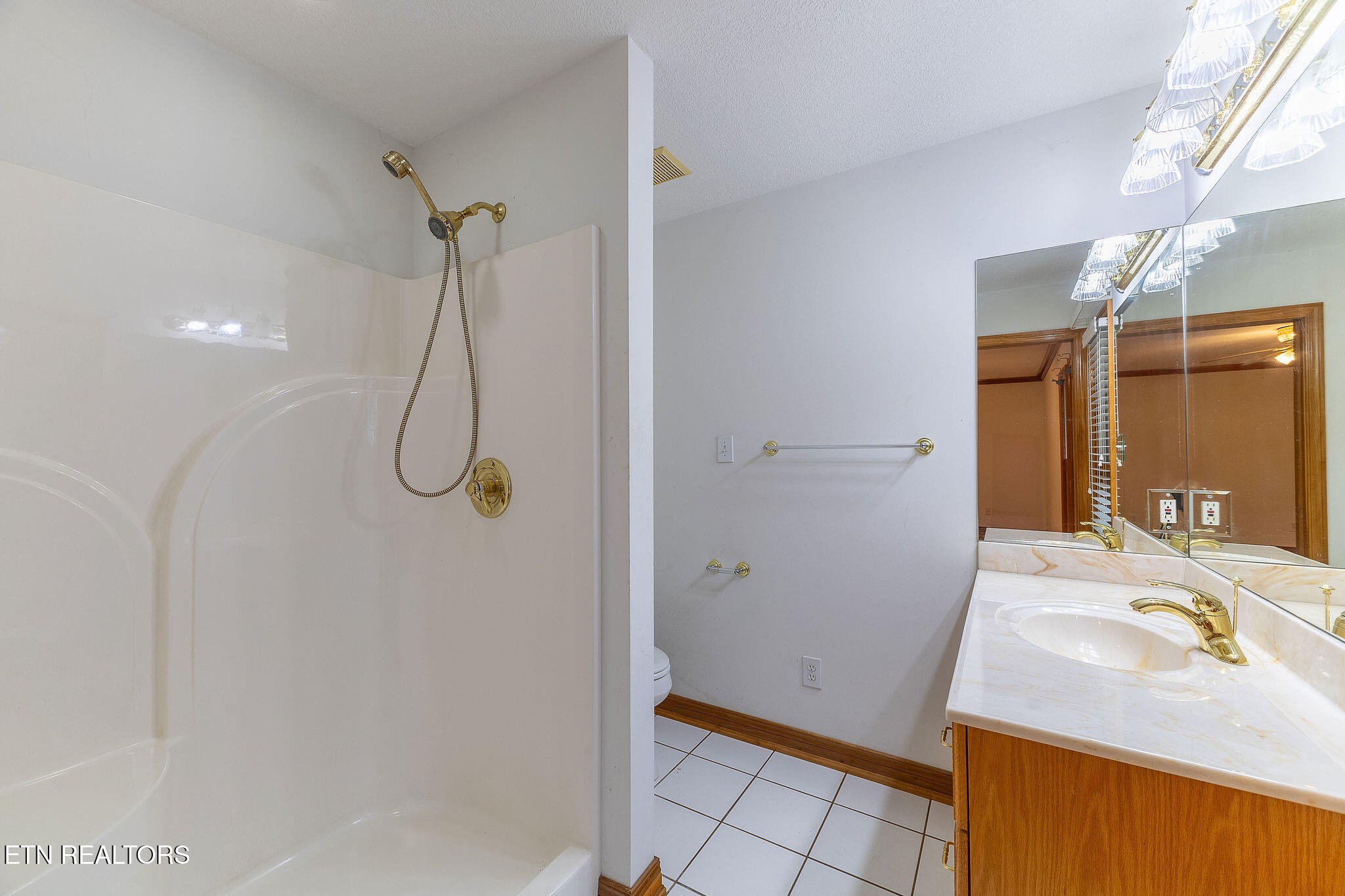 6251 Grimes Road Loudon, TN 37774 - Photo 21 of 43 a bathroom with a sink a vanity and shower