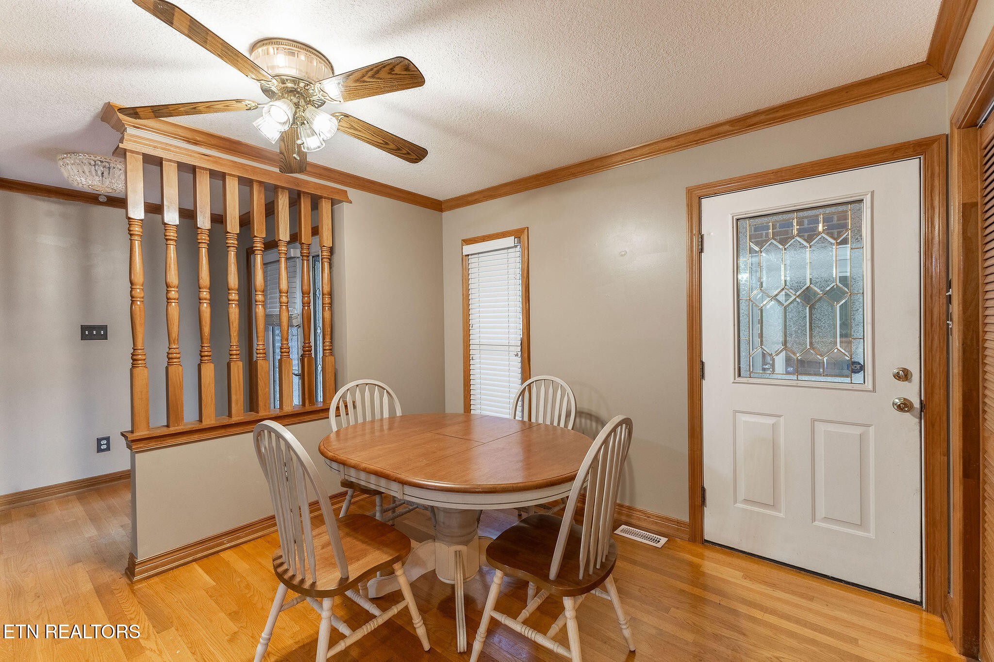 6251 Grimes Road Loudon, TN 37774 - Photo 7 of 43 a view of a dining room with furniture and wooden floor