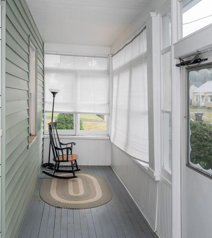 90 Merida Street Springfield, MA 01104 - Photo 3 of 26 a view of a room with wooden floor and windows