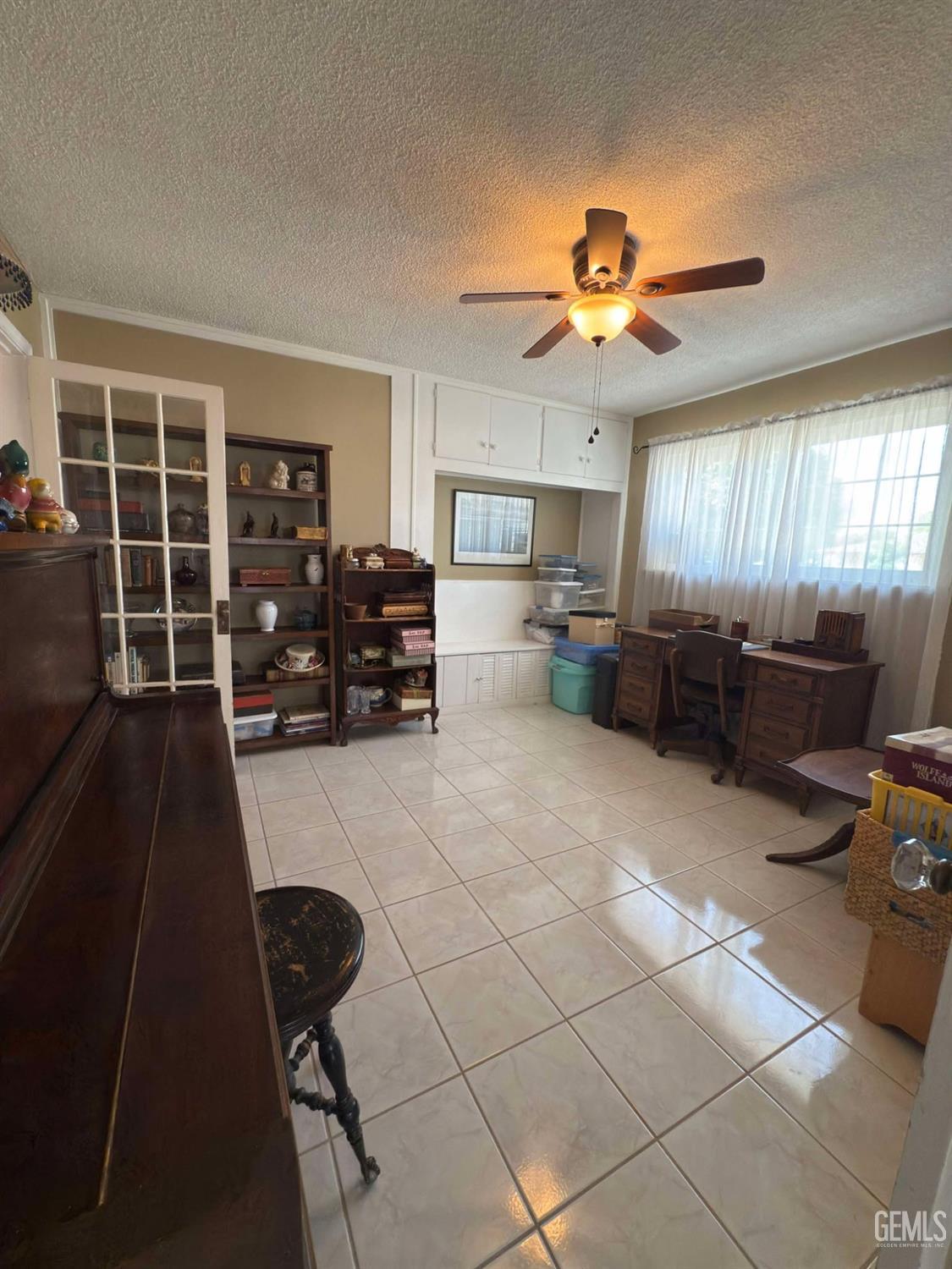 Undisclosed Address Bakersfield, CA 93306 - Photo 12 of 17 a living room with furniture and kitchen view
