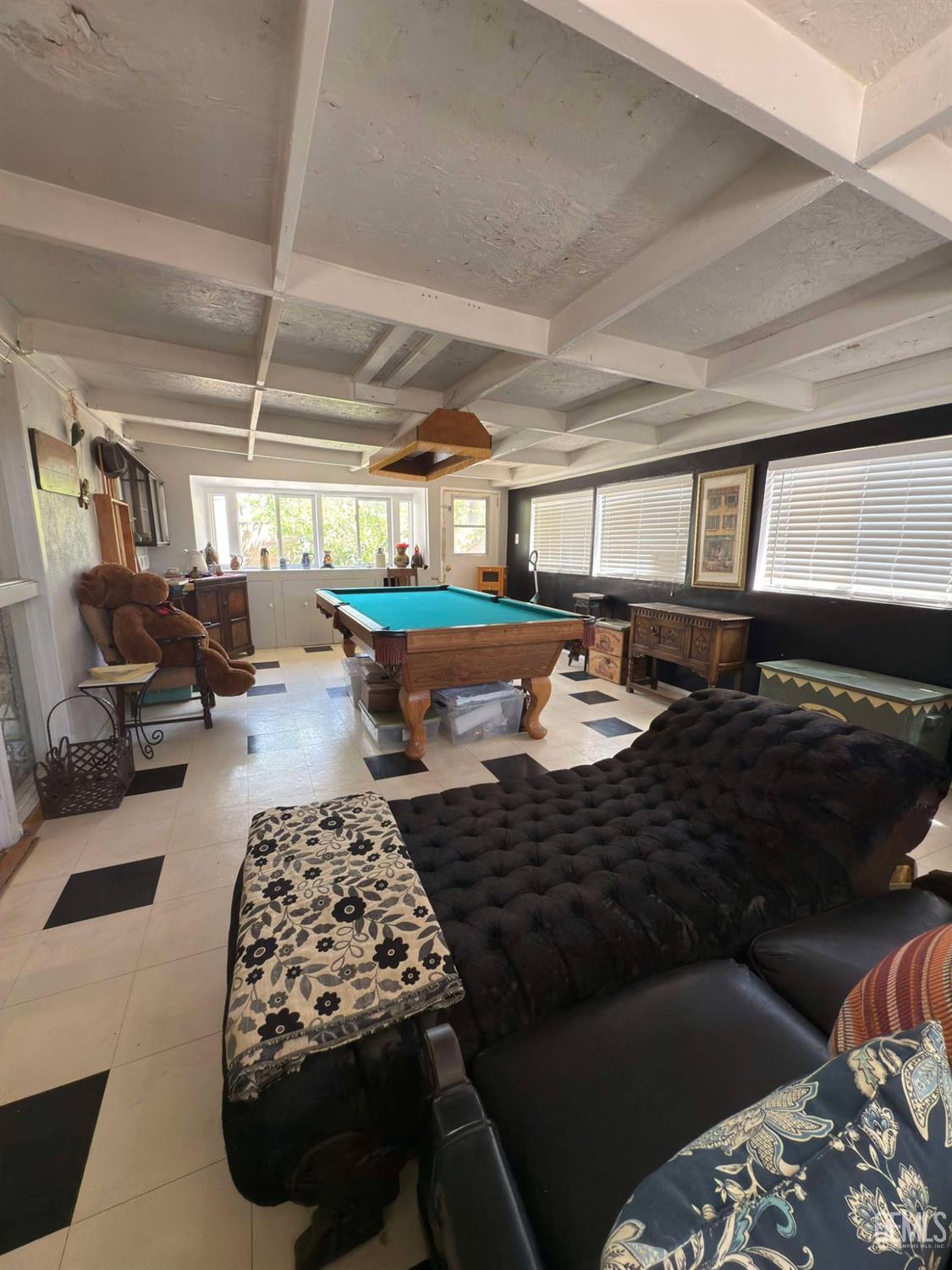 Undisclosed Address Bakersfield, CA 93306 - Photo 14 of 17 a living room with a couch and a table