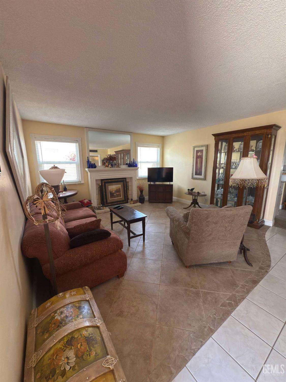 Undisclosed Address Bakersfield, CA 93306 - Photo 3 of 17 a living room with furniture and a flat screen tv