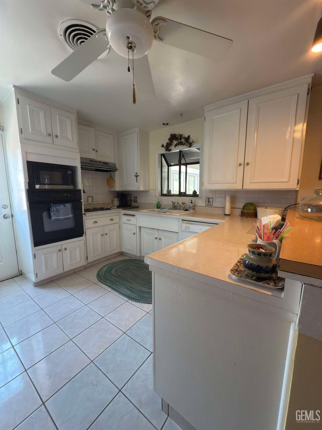 Undisclosed Address Bakersfield, CA 93306 - Photo 5 of 17 a kitchen with stainless steel appliances granite countertop a stove and a sink