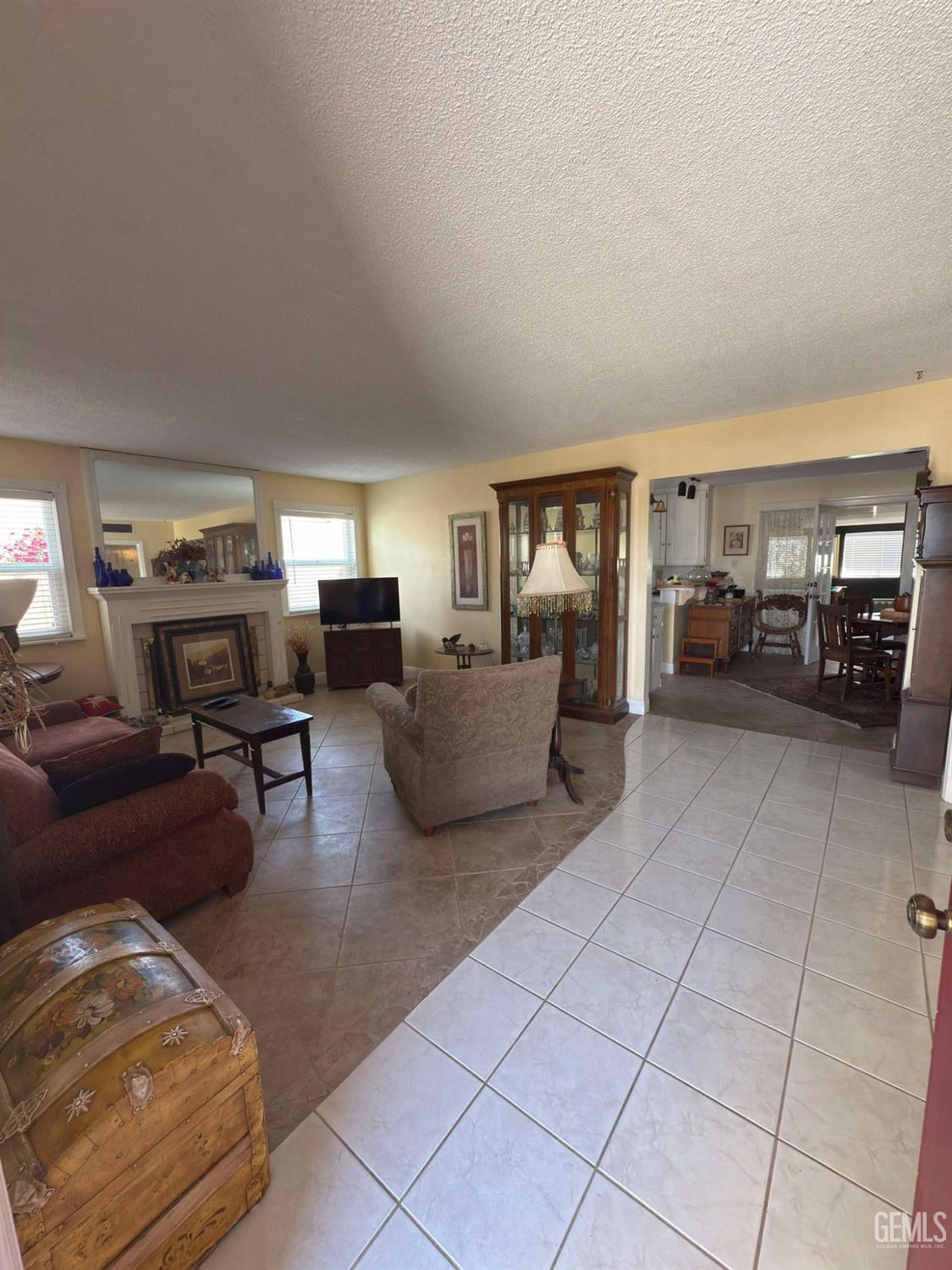Undisclosed Address Bakersfield, CA 93306 - Photo 8 of 17 a living room with furniture and a flat screen tv