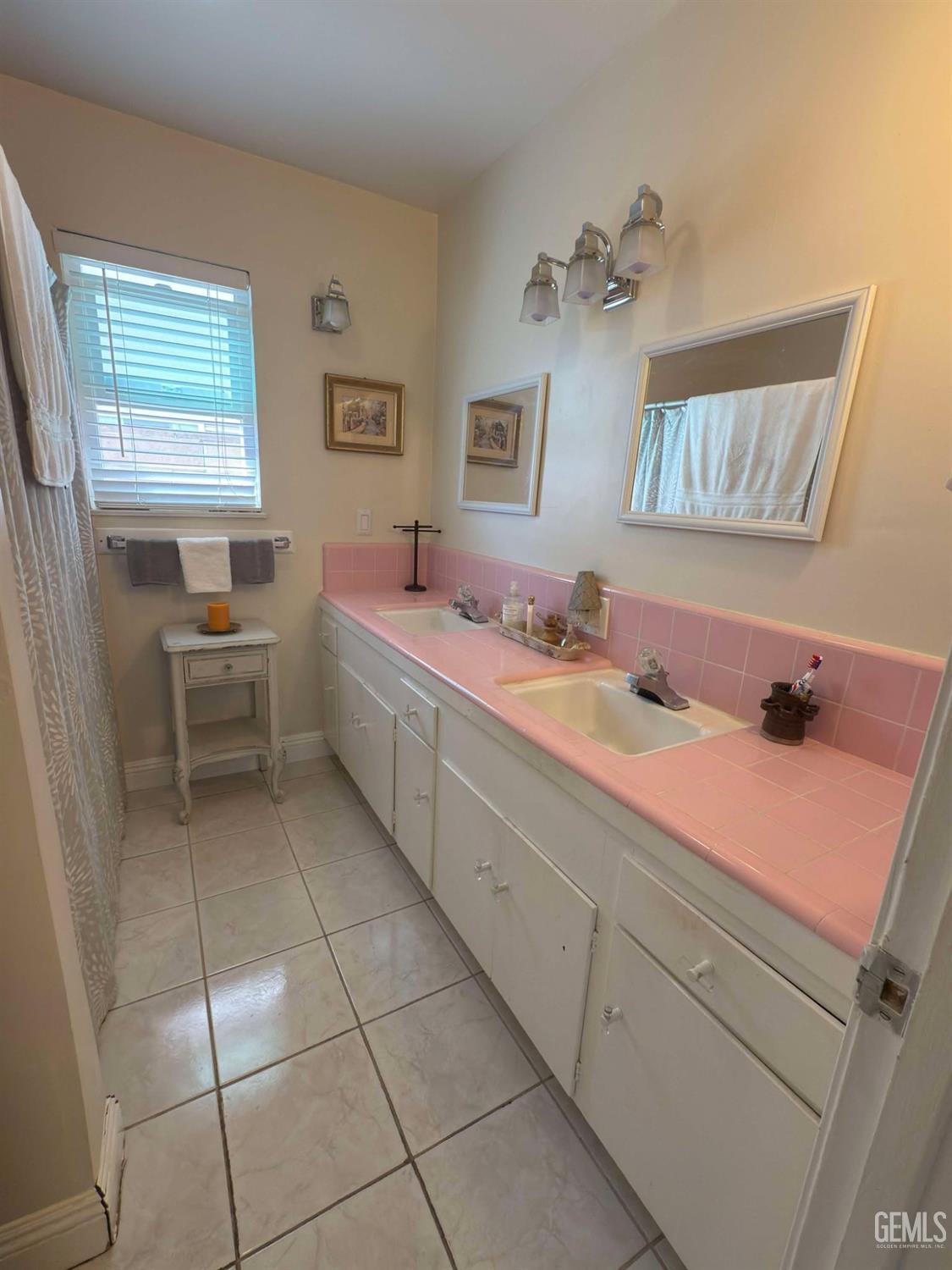 Undisclosed Address Bakersfield, CA 93306 - Photo 10 of 17 a bathroom with a sink and a mirror