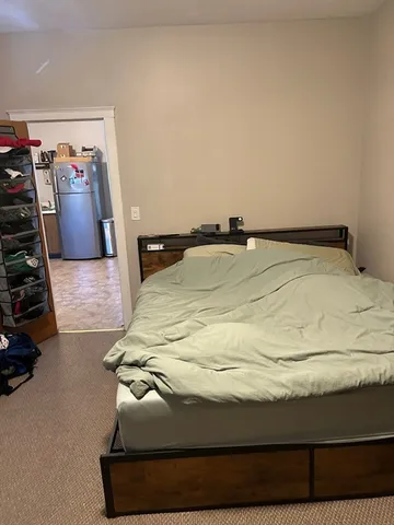 a bedroom with a bed and pillows