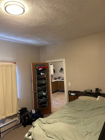 a bed room with a bed and a tv