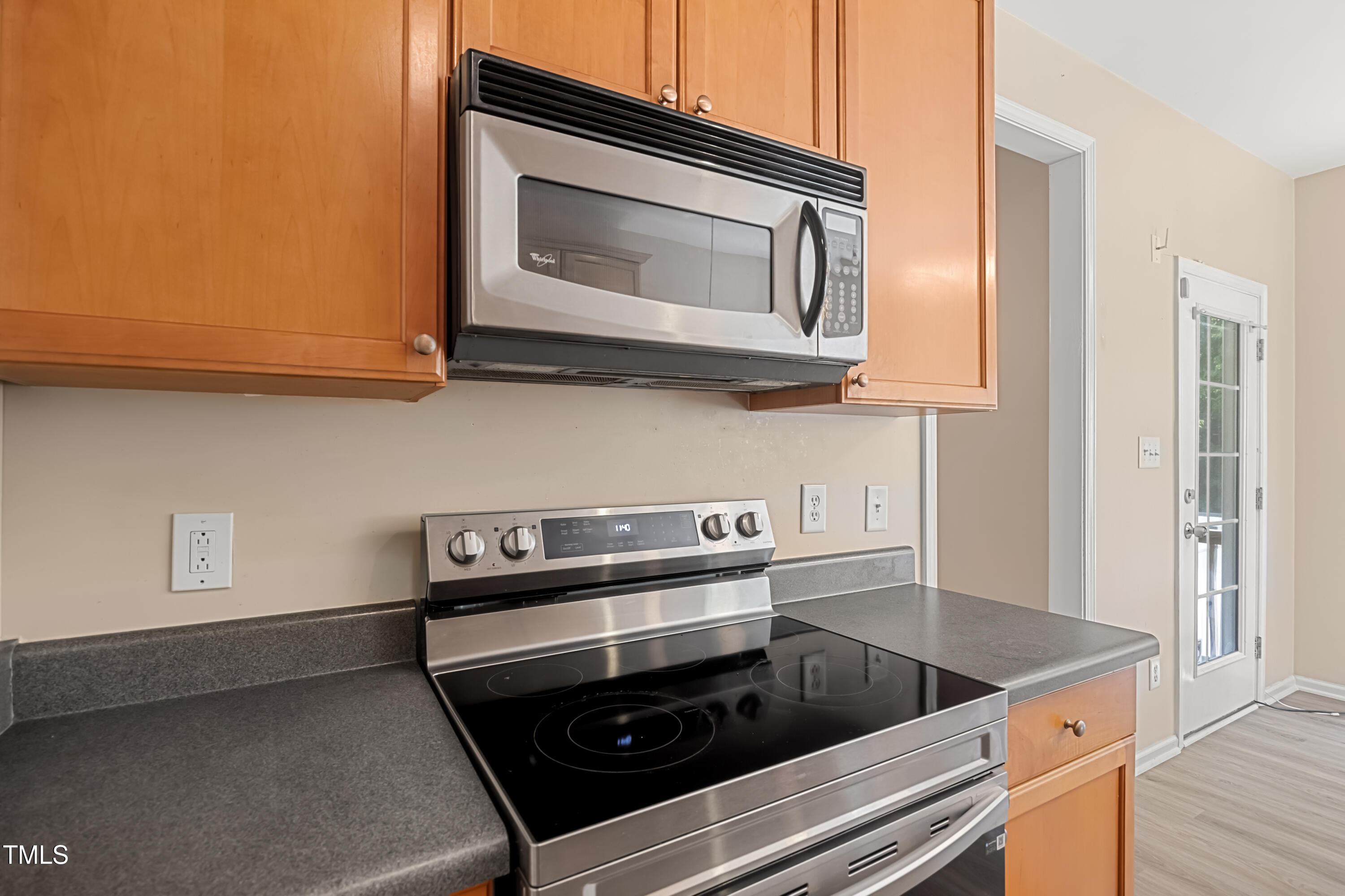 5865 Forest Point Road Raleigh, NC 27610 - Photo 13 of 37 a kitchen with a stove microwave and sink