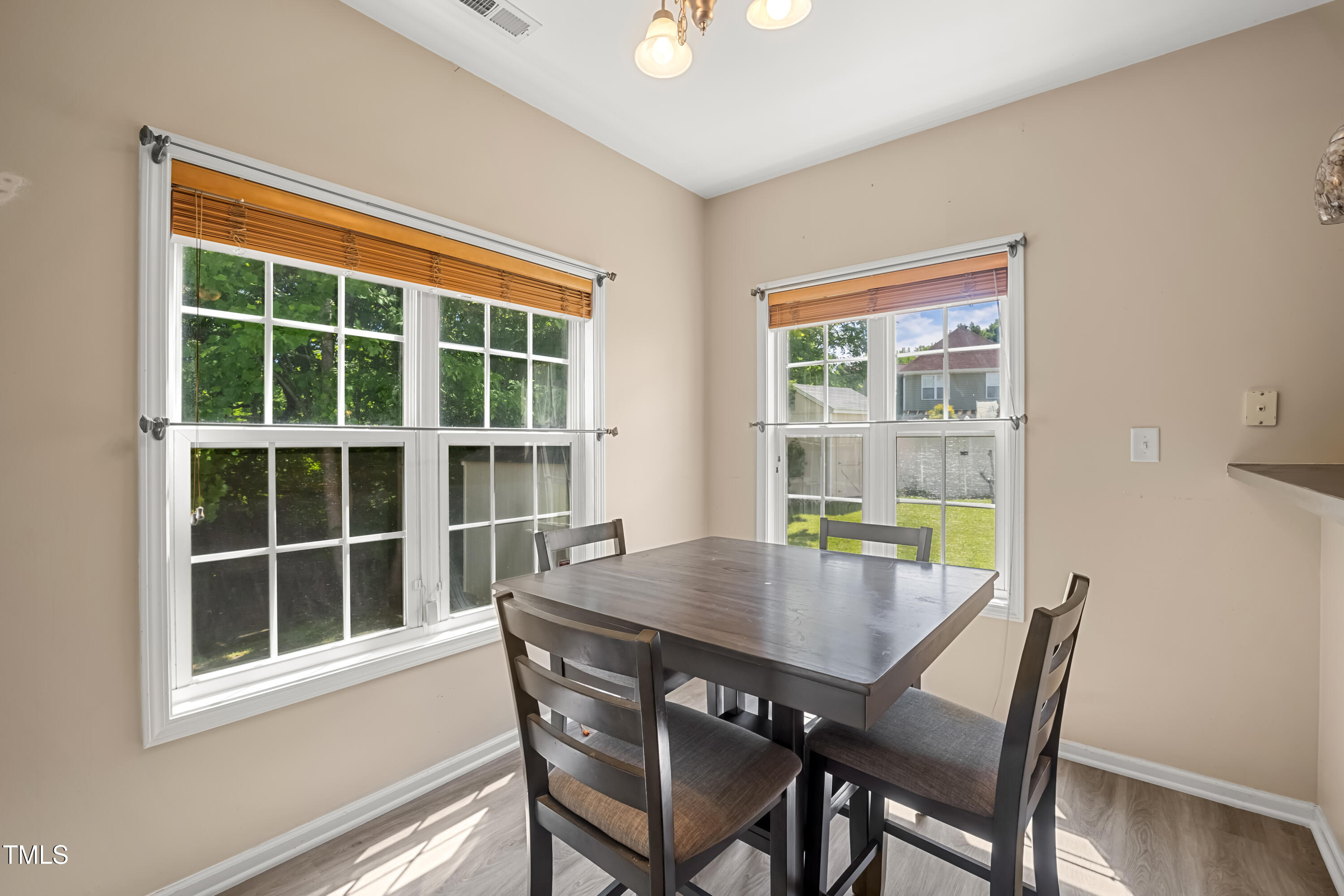 5865 Forest Point Road Raleigh, NC 27610 - Photo 15 of 37 a view of a dining room with furniture and window