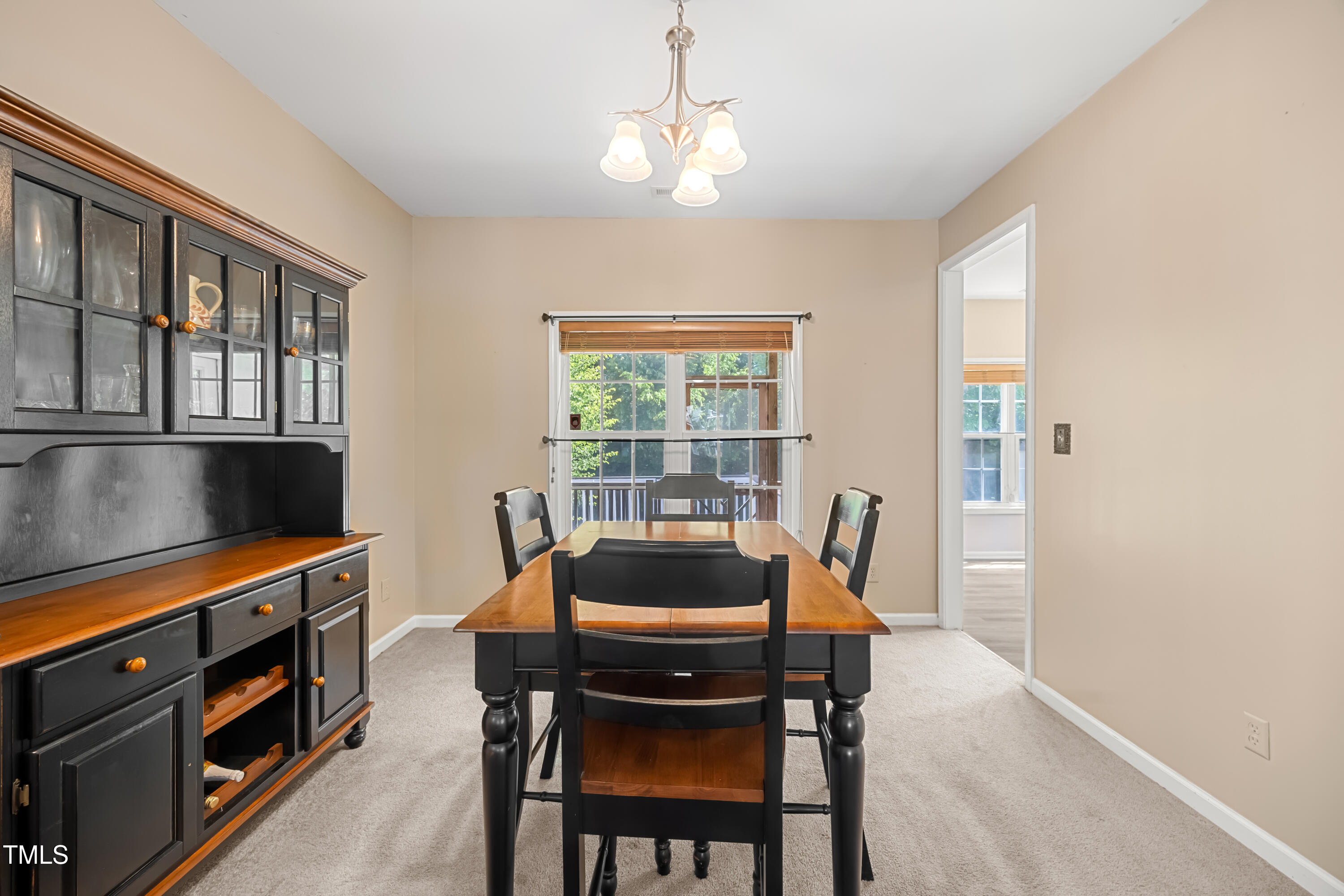 5865 Forest Point Road Raleigh, NC 27610 - Photo 16 of 37 a view of a dining room with furniture window and outside view