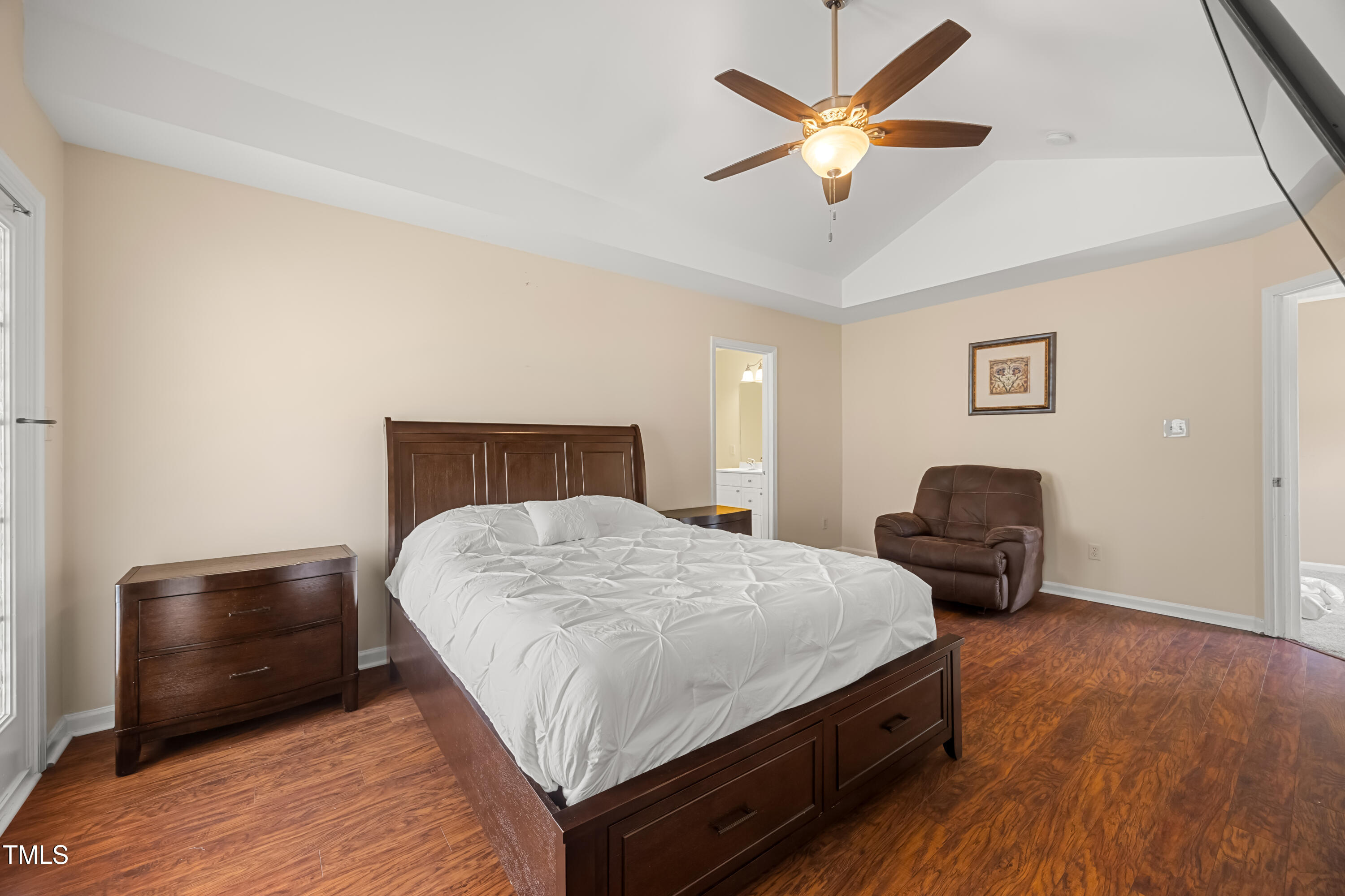 5865 Forest Point Road Raleigh, NC 27610 - Photo 19 of 37 a bedroom with a bed and dresser
