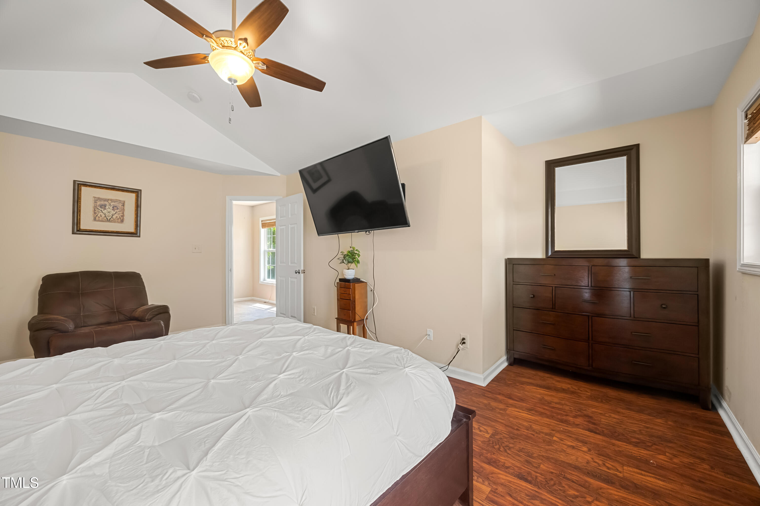 5865 Forest Point Road Raleigh, NC 27610 - Photo 20 of 37 a bedroom with a bed and a flat screen tv